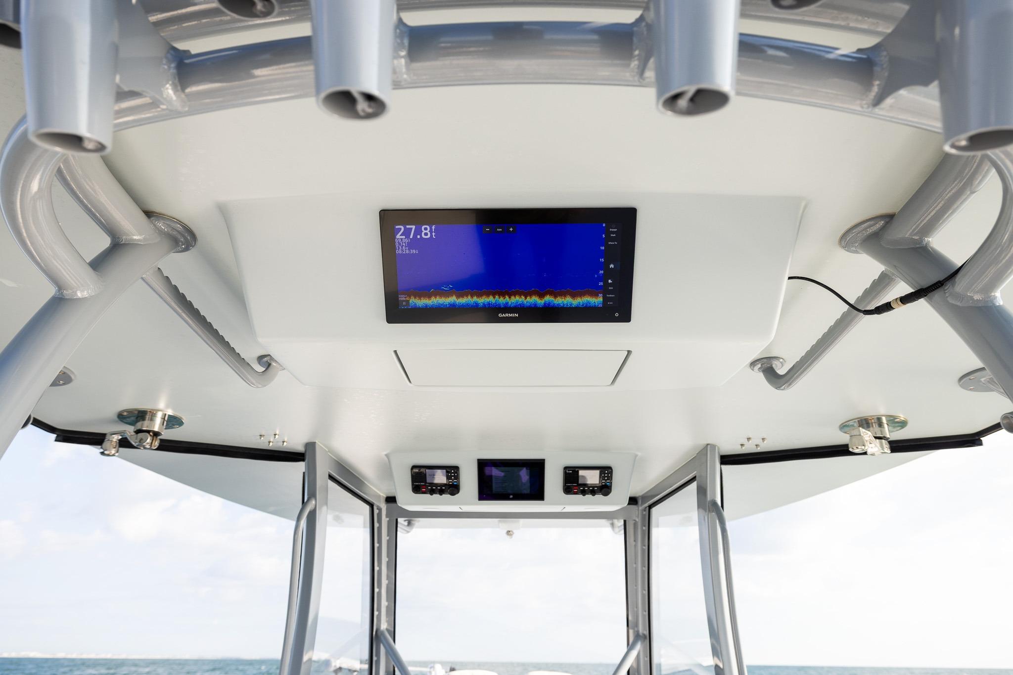 Interior view of 2026 Front Runner 37 Catamaran with advanced navigation display.