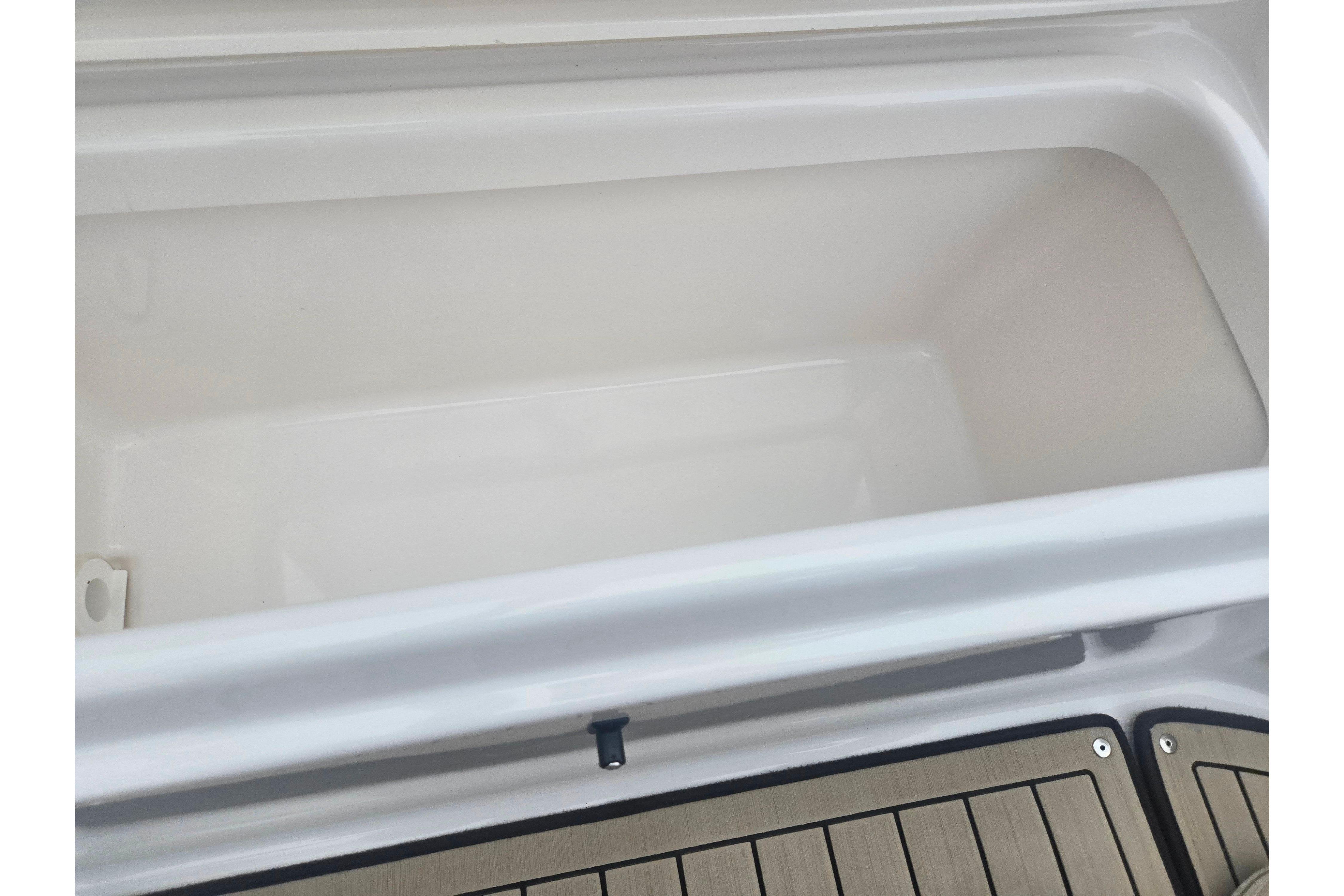 Open storage compartment on 2022 Yamaha Boats 195 FSH Sport.