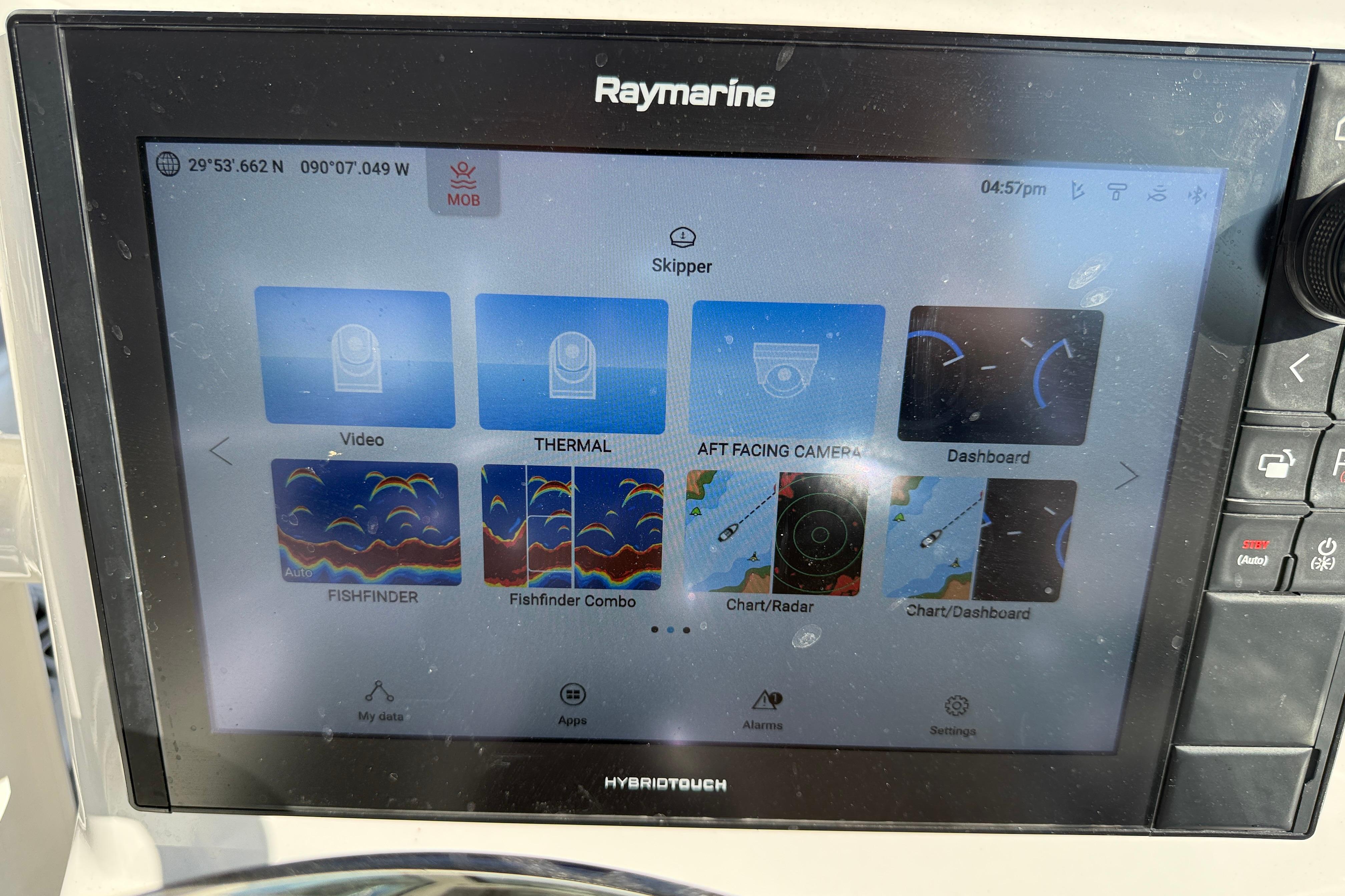 Raymarine display on 2022 Caymas 28 HB Twin, showing navigation and fishfinder features.