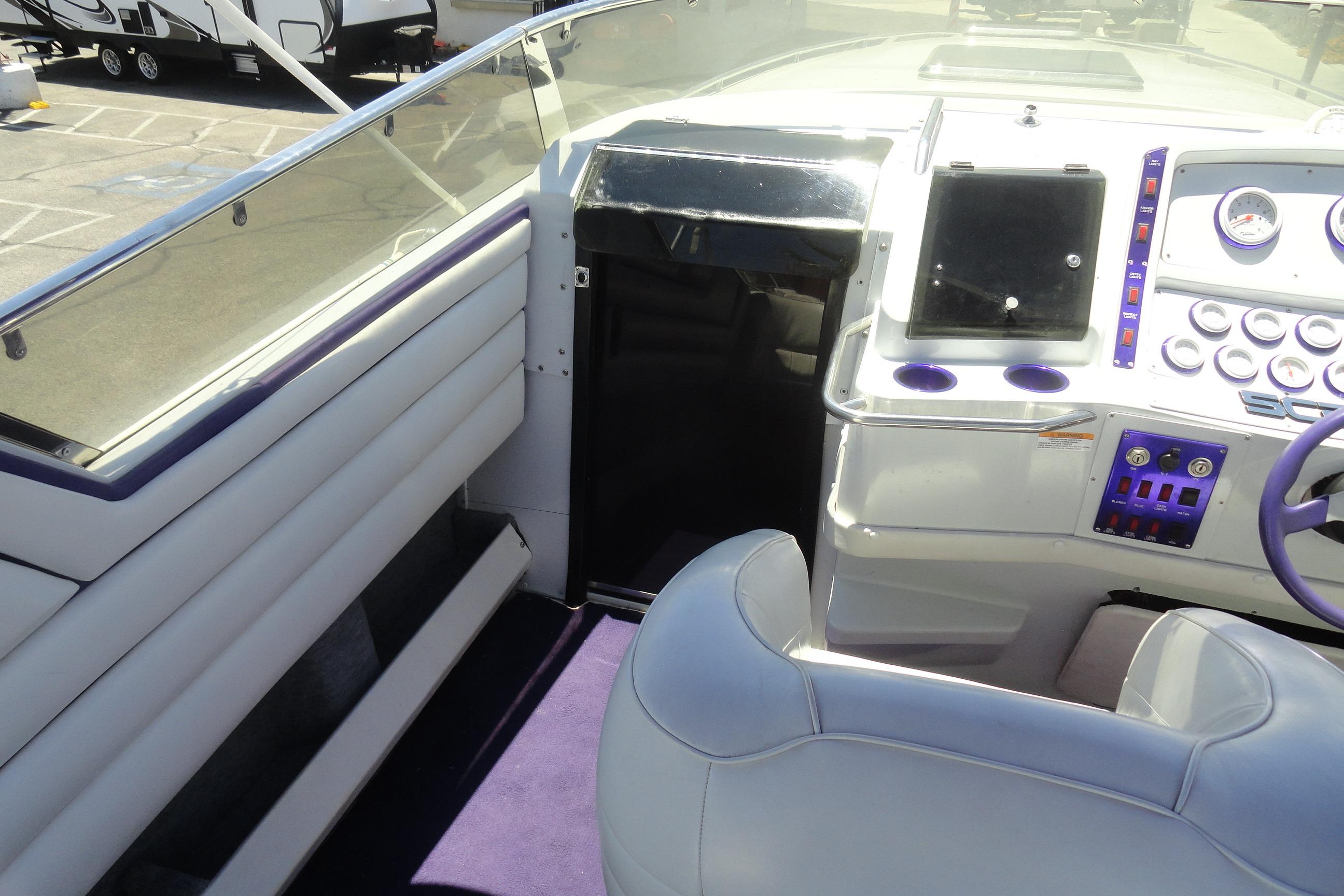 Interior cockpit of 1988 Wellcraft 34 Scarab boat with modern controls and seating.