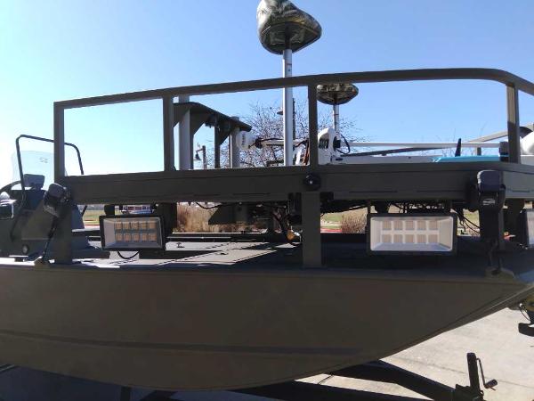 2024 Tracker Grizzly 2072 CC Sportsman boat with elevated deck and mounted lights.