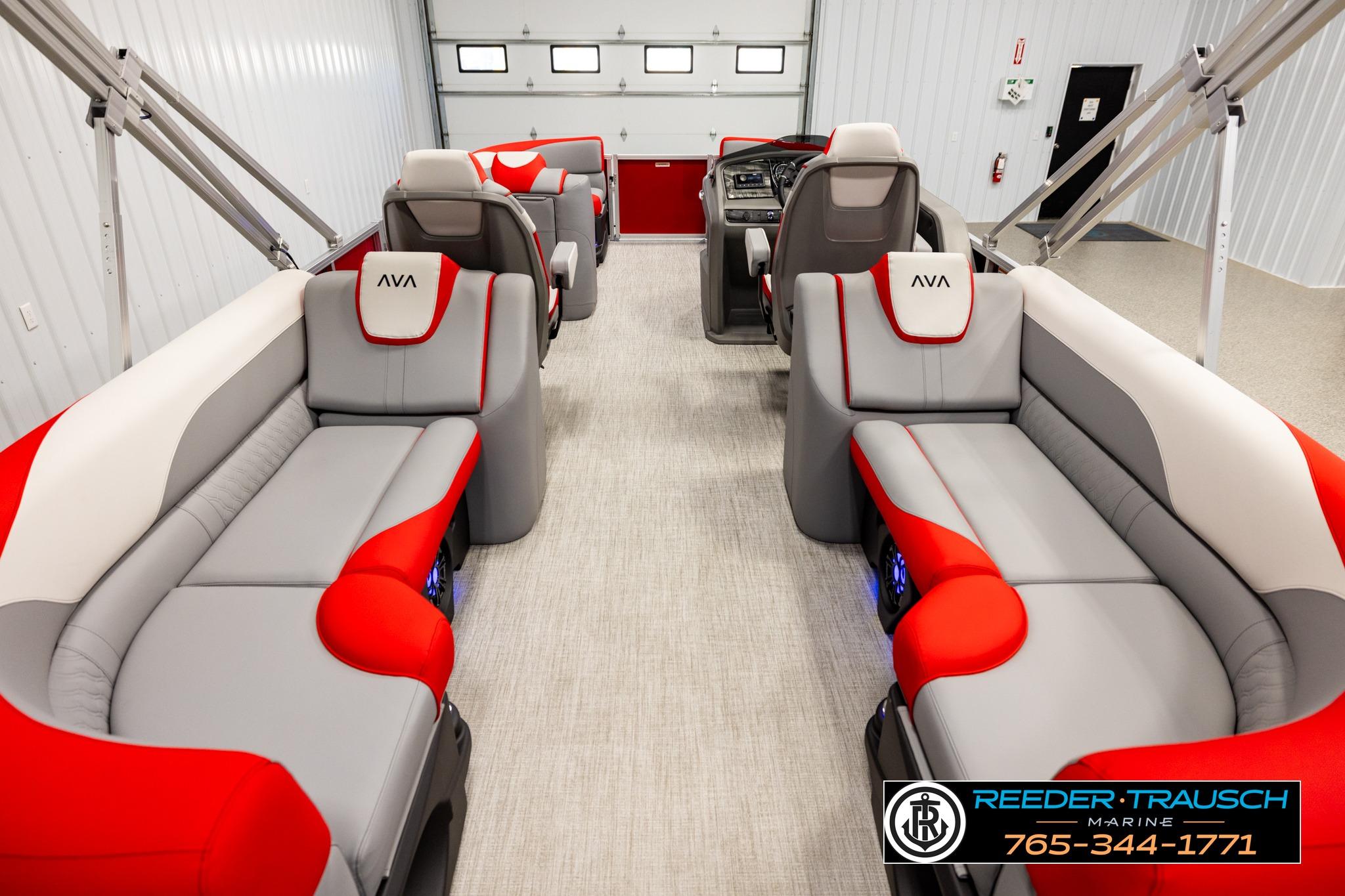 Luxurious interior of 2026 Avalon LSZ QL pontoon boat with red and gray seating.