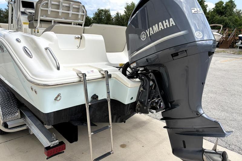 2024 Key West 239 FS boat with Yamaha 250 engine and swim ladder.