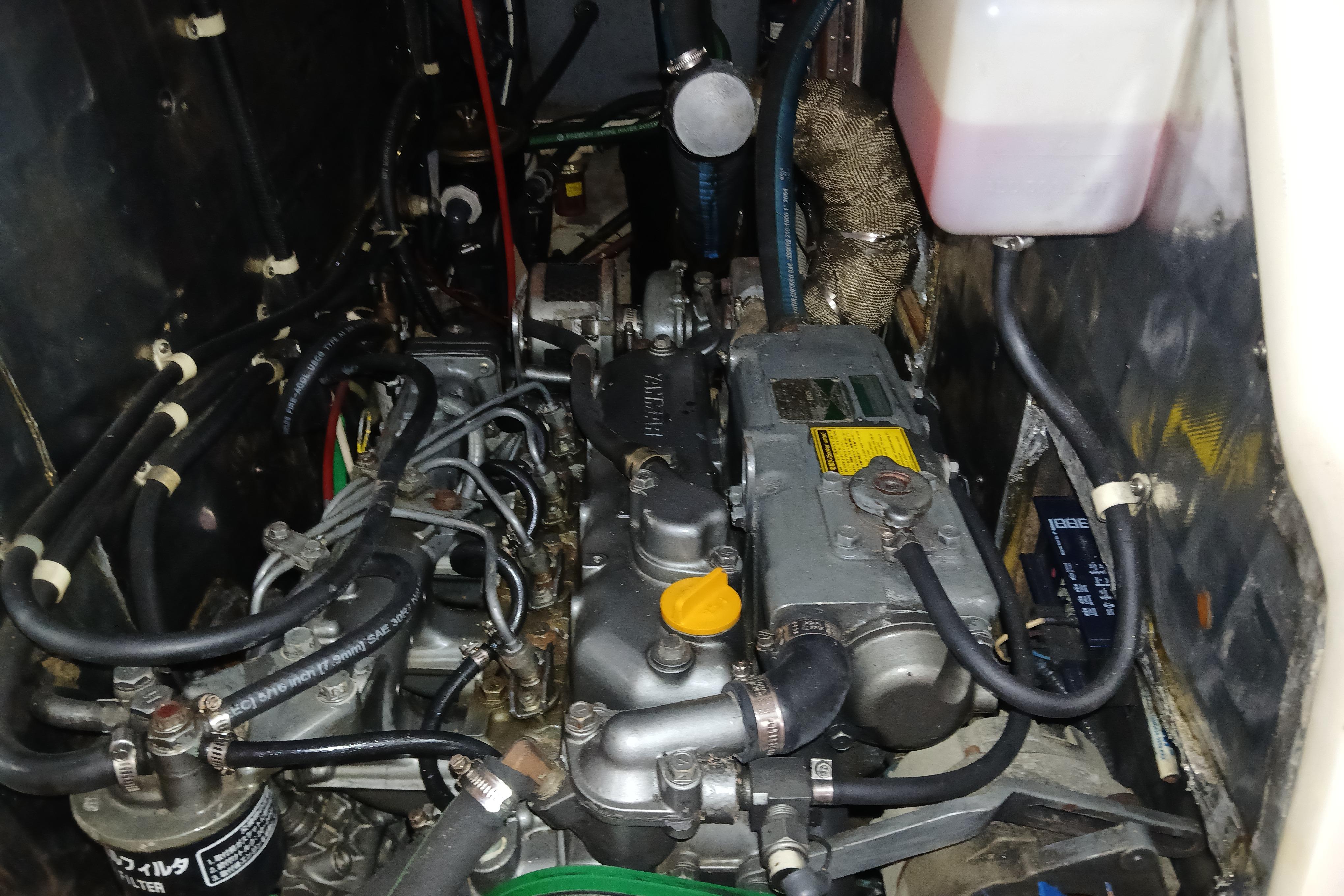 Engine compartment of a 1995 Catalina 42 MkII sailboat, showcasing intricate mechanical components.