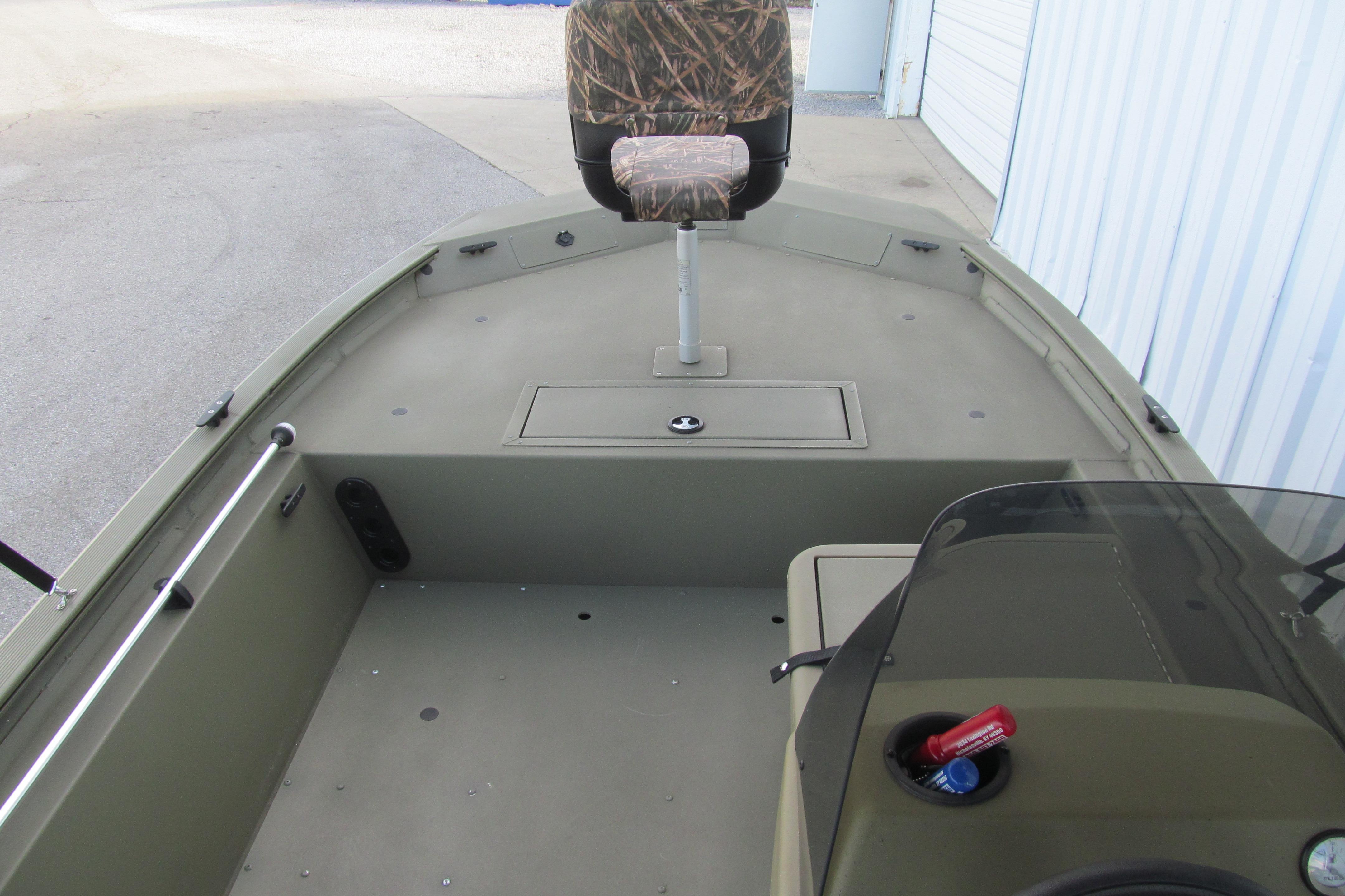2018 Tracker Grizzly 1754 SC boat interior with camo seat and storage compartment.