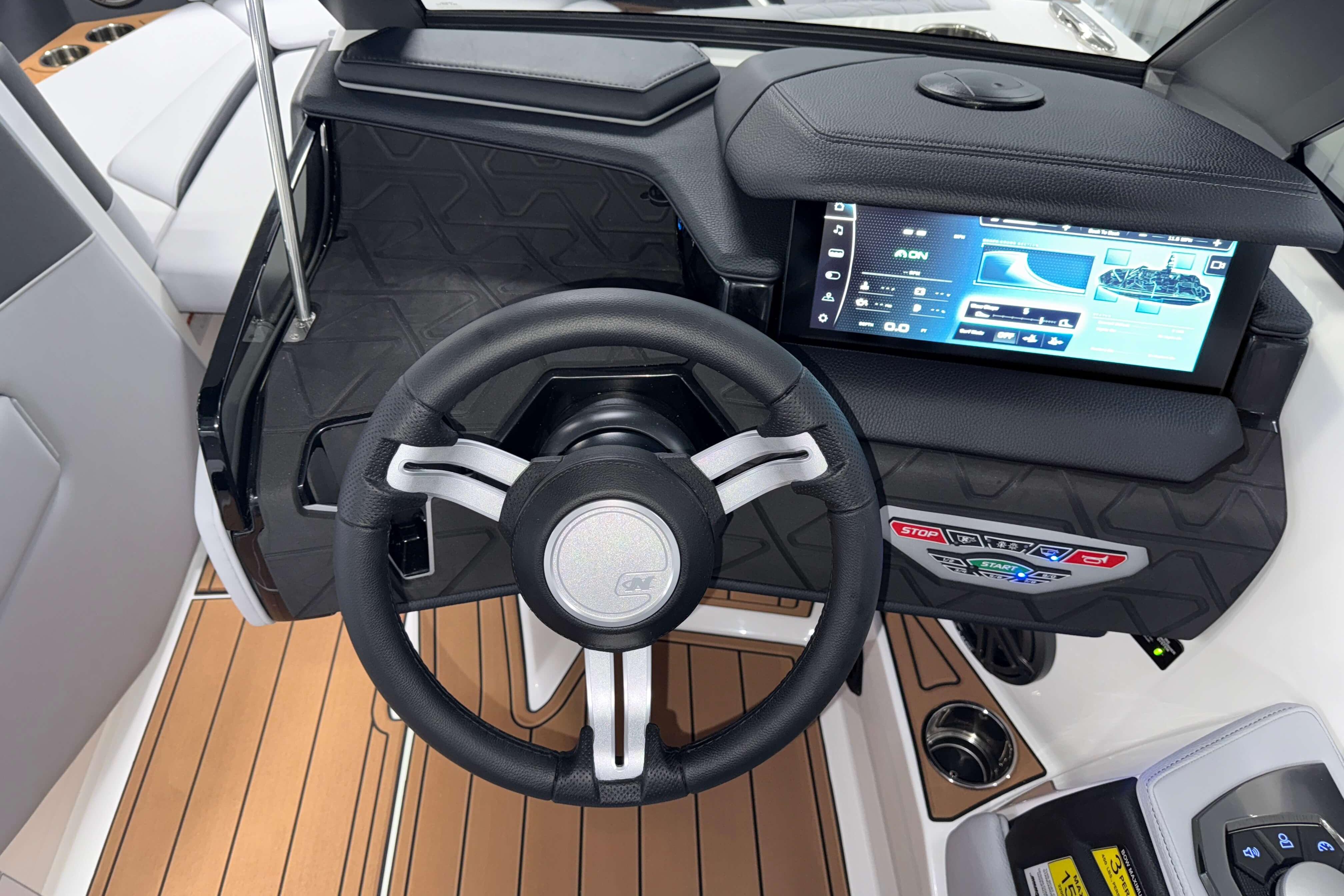 2026 Nautique Super Air Nautique GS22 dashboard with touchscreen and steering wheel.