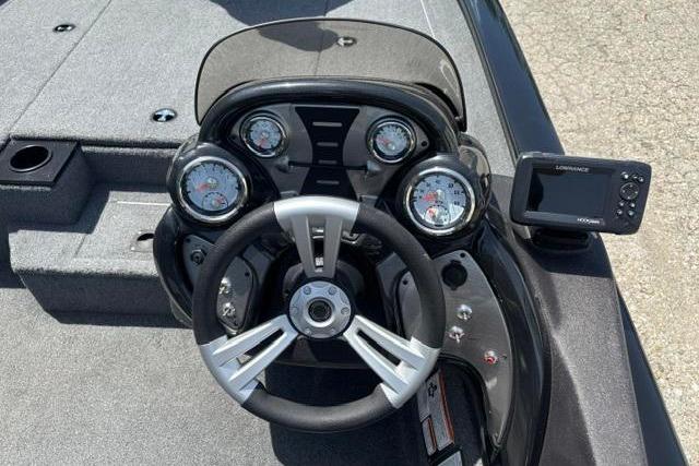 2023 Tracker Pro Team 190 TX Tournament Edition boat dashboard with steering wheel and gauges.
