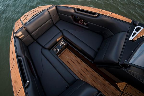 Manufacturer Provided Image: 2025 Moomba Mojo boat interior with sleek black seating and wooden accents.