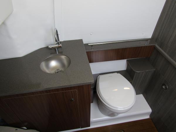 2024 Wellcraft 352 Fisherman boat bathroom with sink and toilet