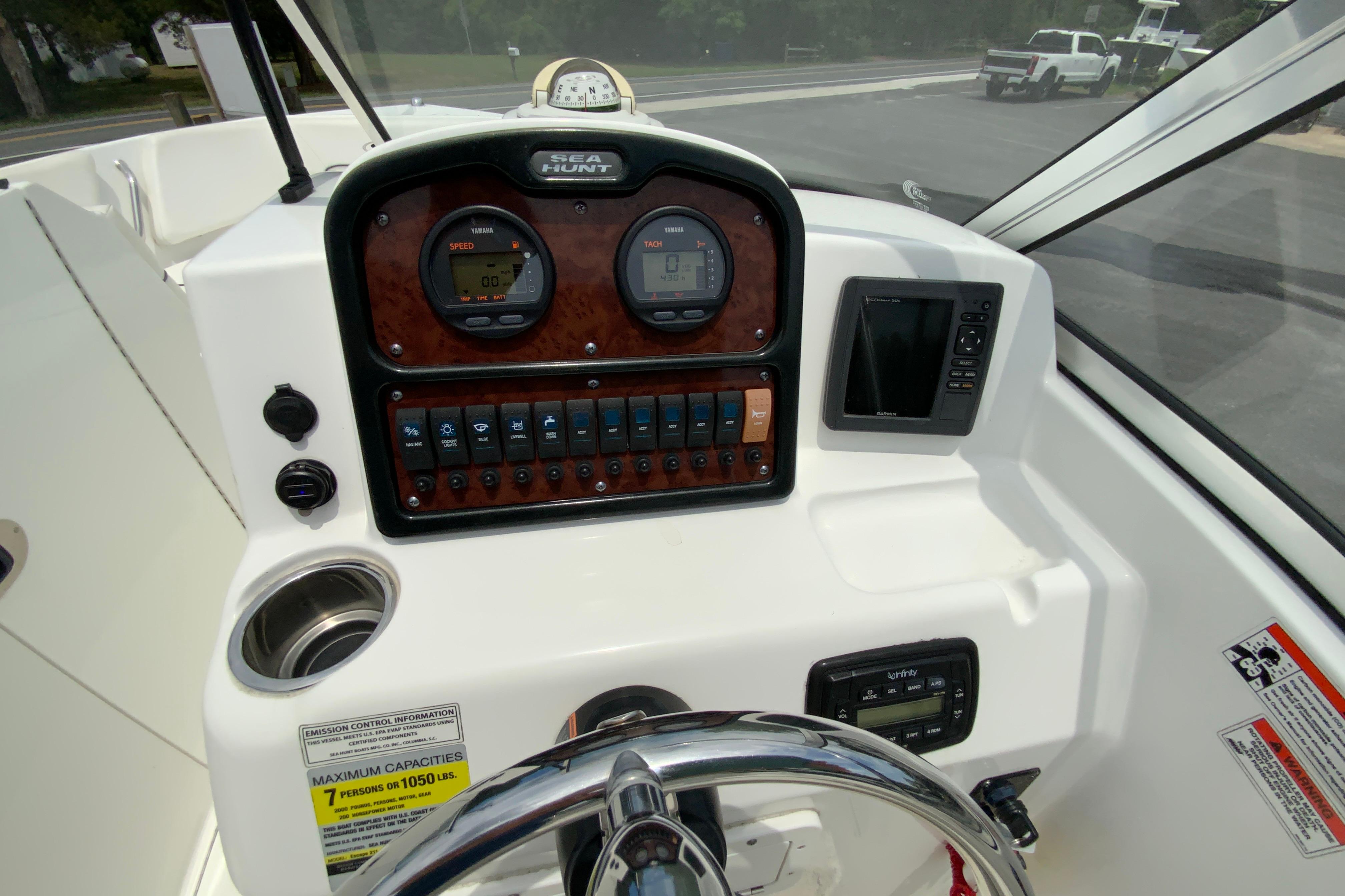 2014 Sea Hunt Escape 211 LE boat dashboard with gauges and controls.