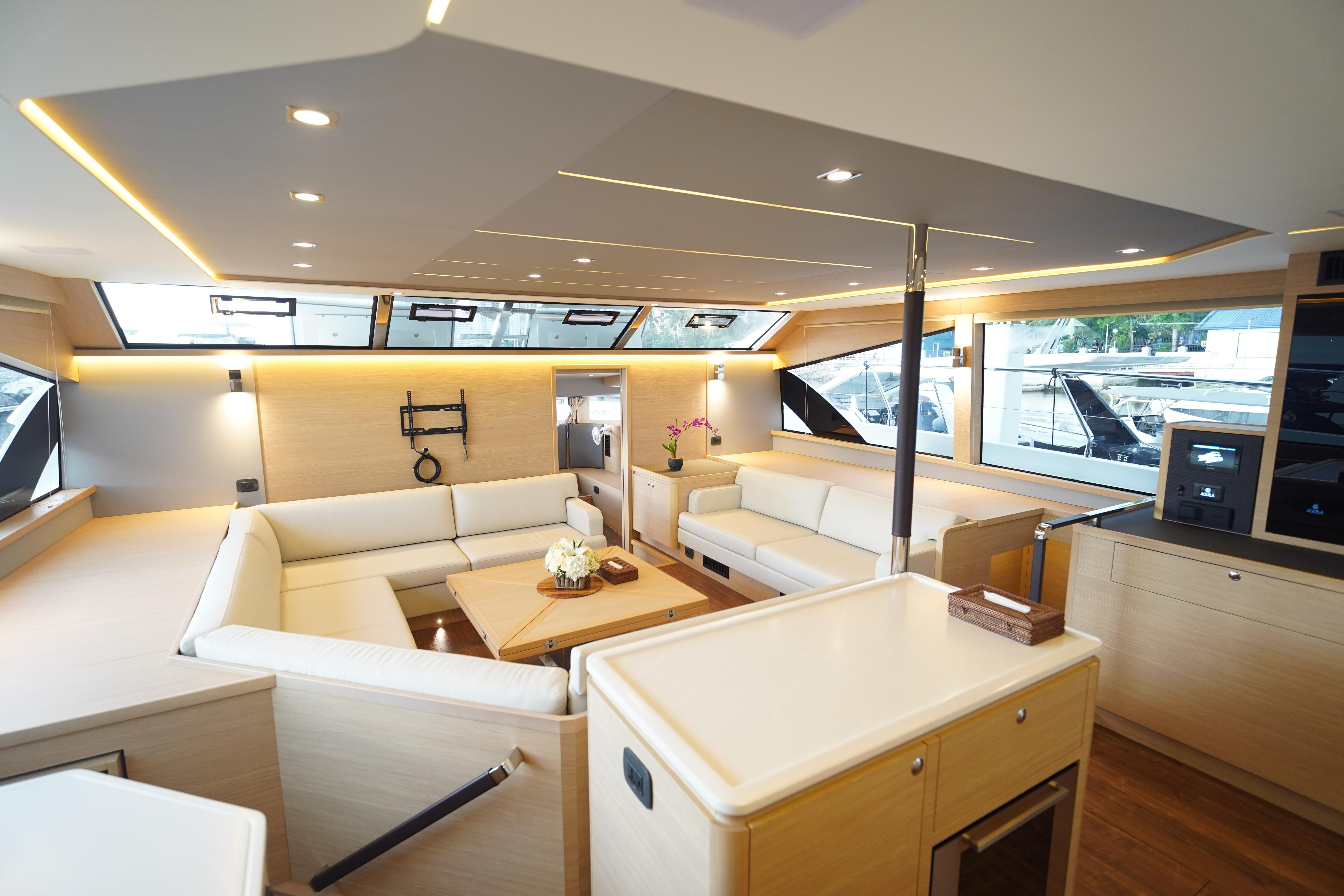 Luxurious interior of 2025 Aquila 54 Yacht with modern furnishings and ample natural light.