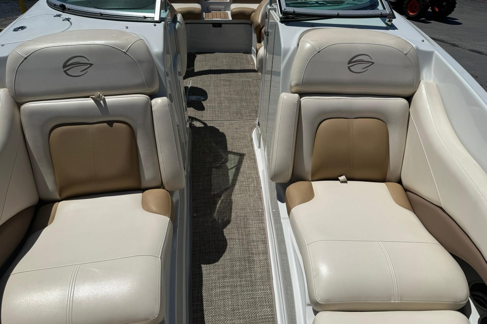 2016 Crownline 255 SS boat interior with beige and white leather seating.