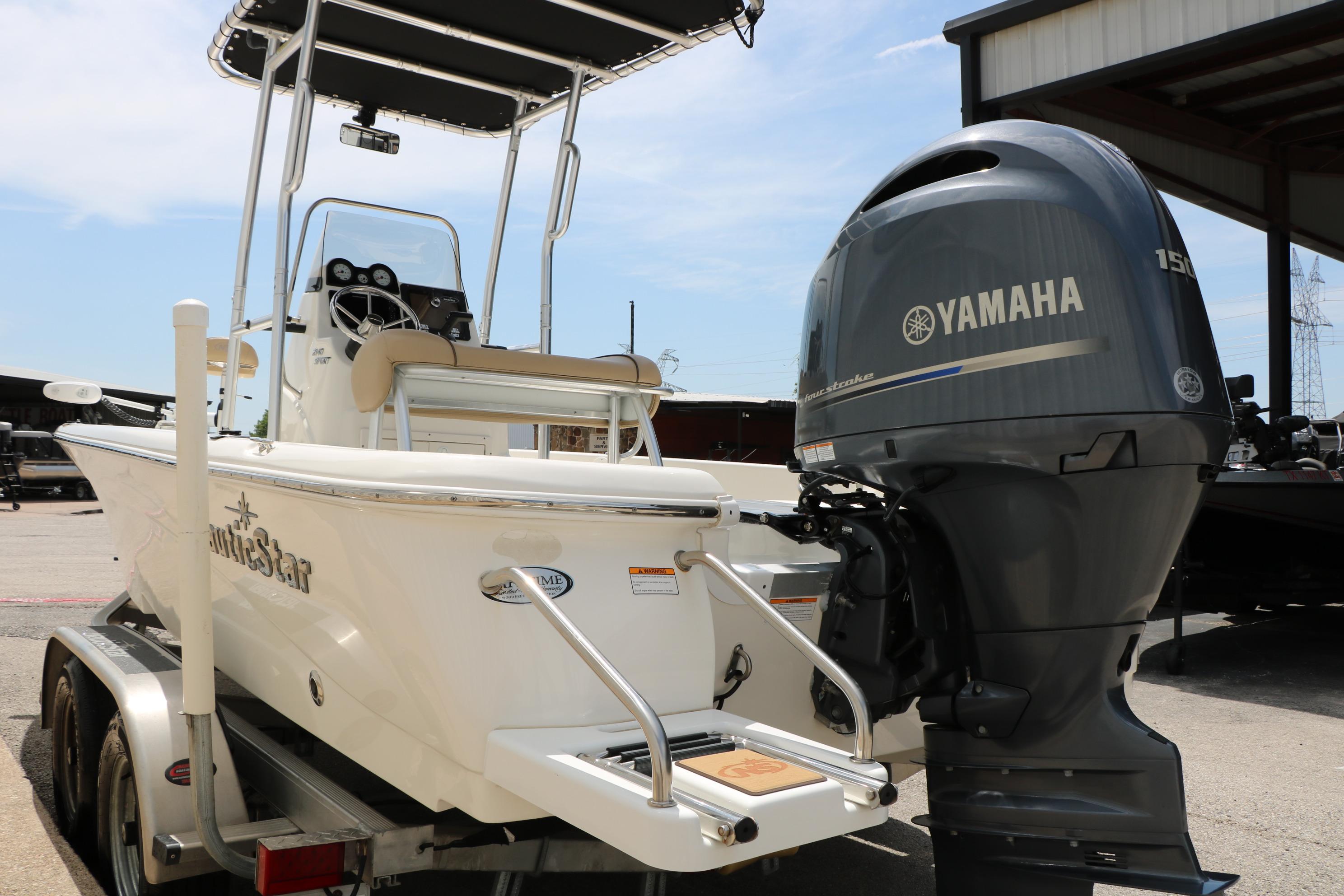 2020 NauticStar 2140 Sport boat with Yamaha outboard motor on trailer.