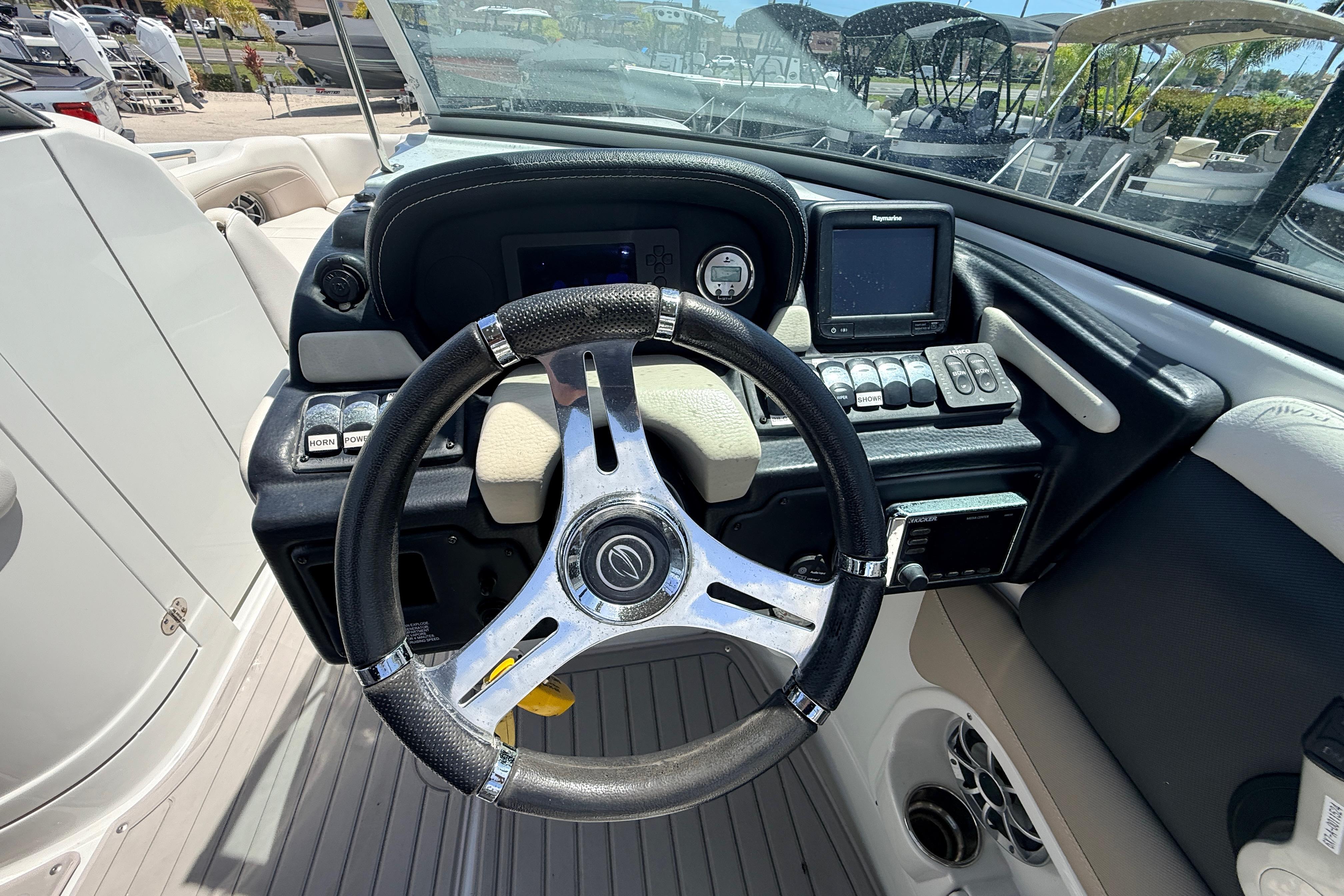 Steering console of 2018 Crownline Eclipse E26 XS boat with modern controls and navigation system.