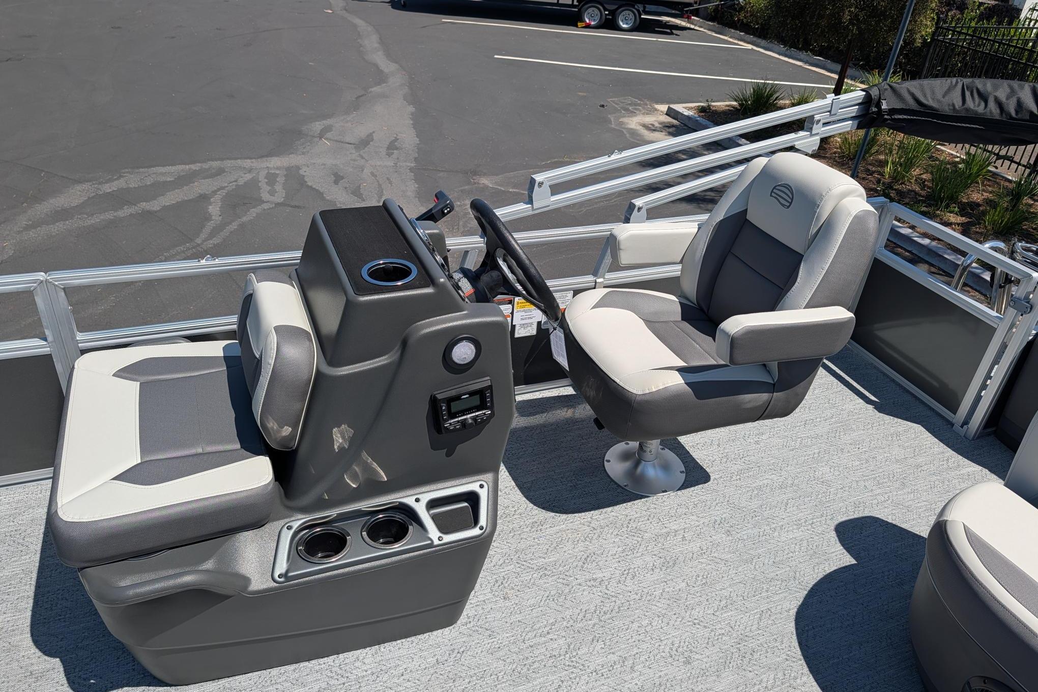 2026 Sun Tracker Bass Buggy 18 DLX pontoon boat interior with seating and console.