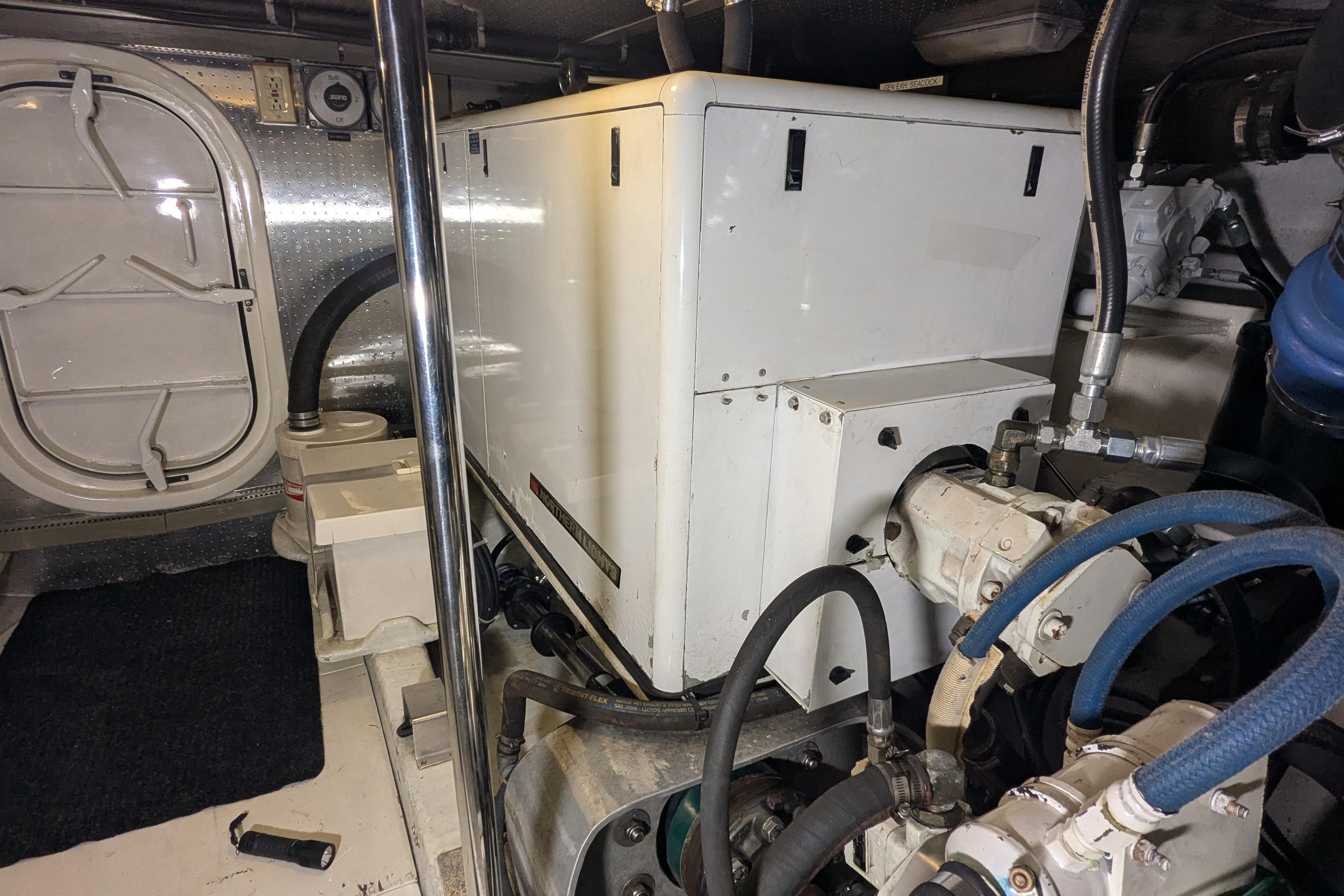 Engine room of a 2005 Kadey-Krogen Pilothouse with machinery and equipment.