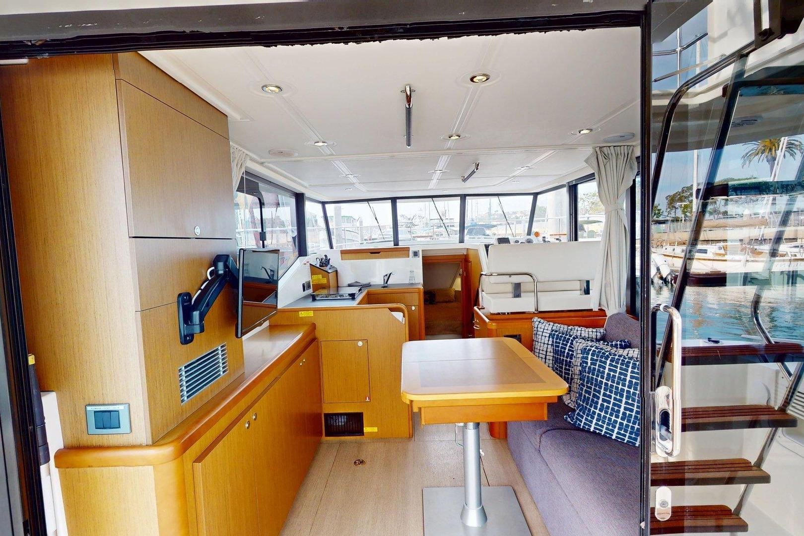 Interior of 2021 Beneteau Swift Trawler 35, featuring modern wood finishes and comfortable seating.