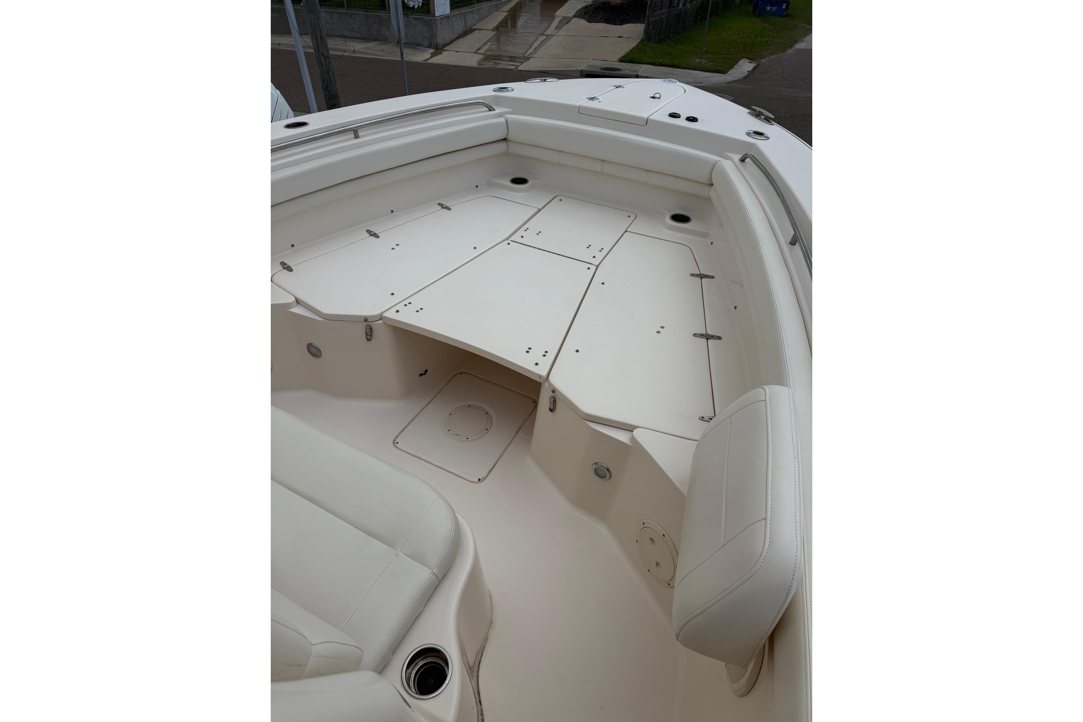 2018 Grady-White Canyon 306 boat interior with white seating and storage compartments.