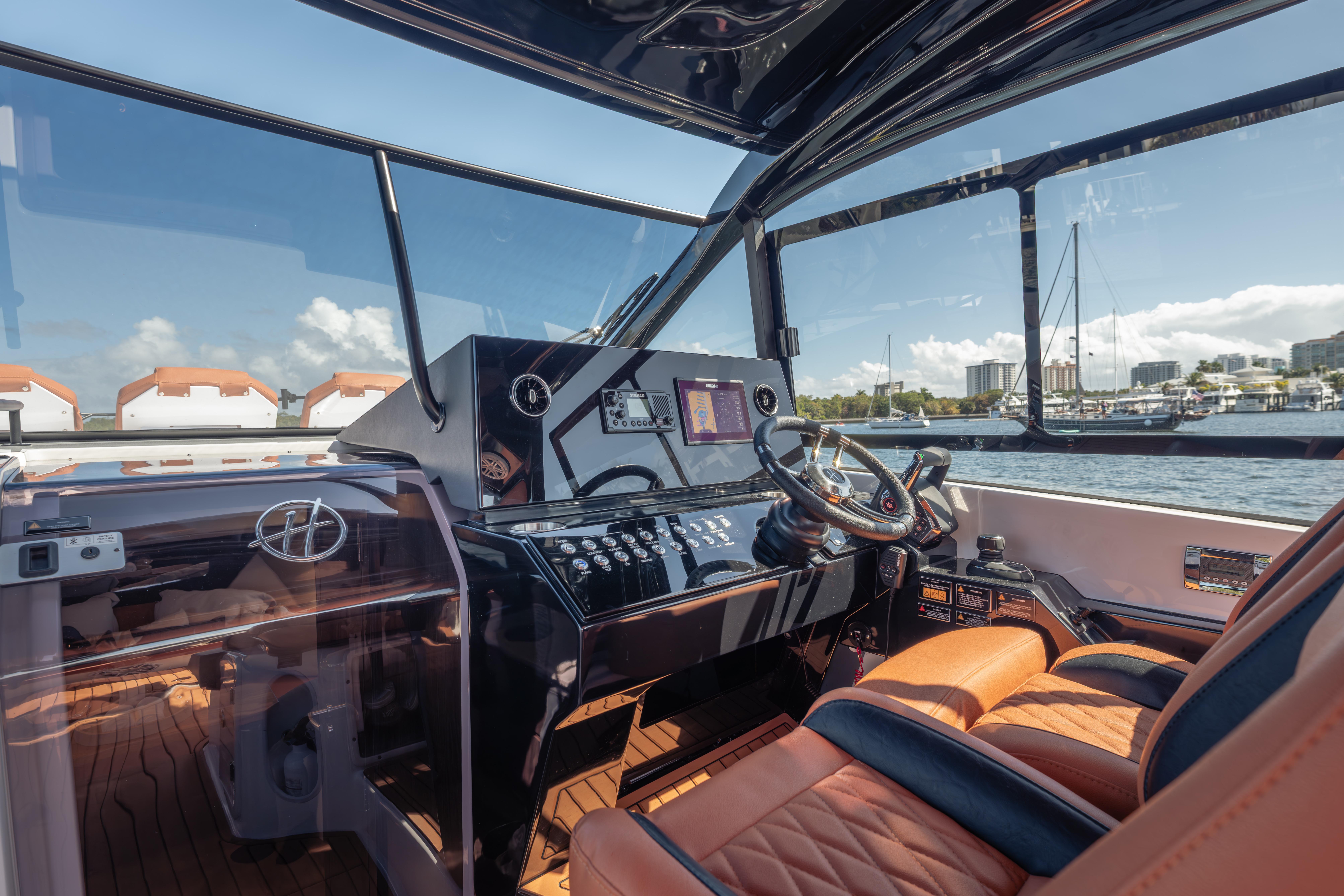 Interior view of 2026 Hanover 387 yacht cockpit with luxurious leather seating.