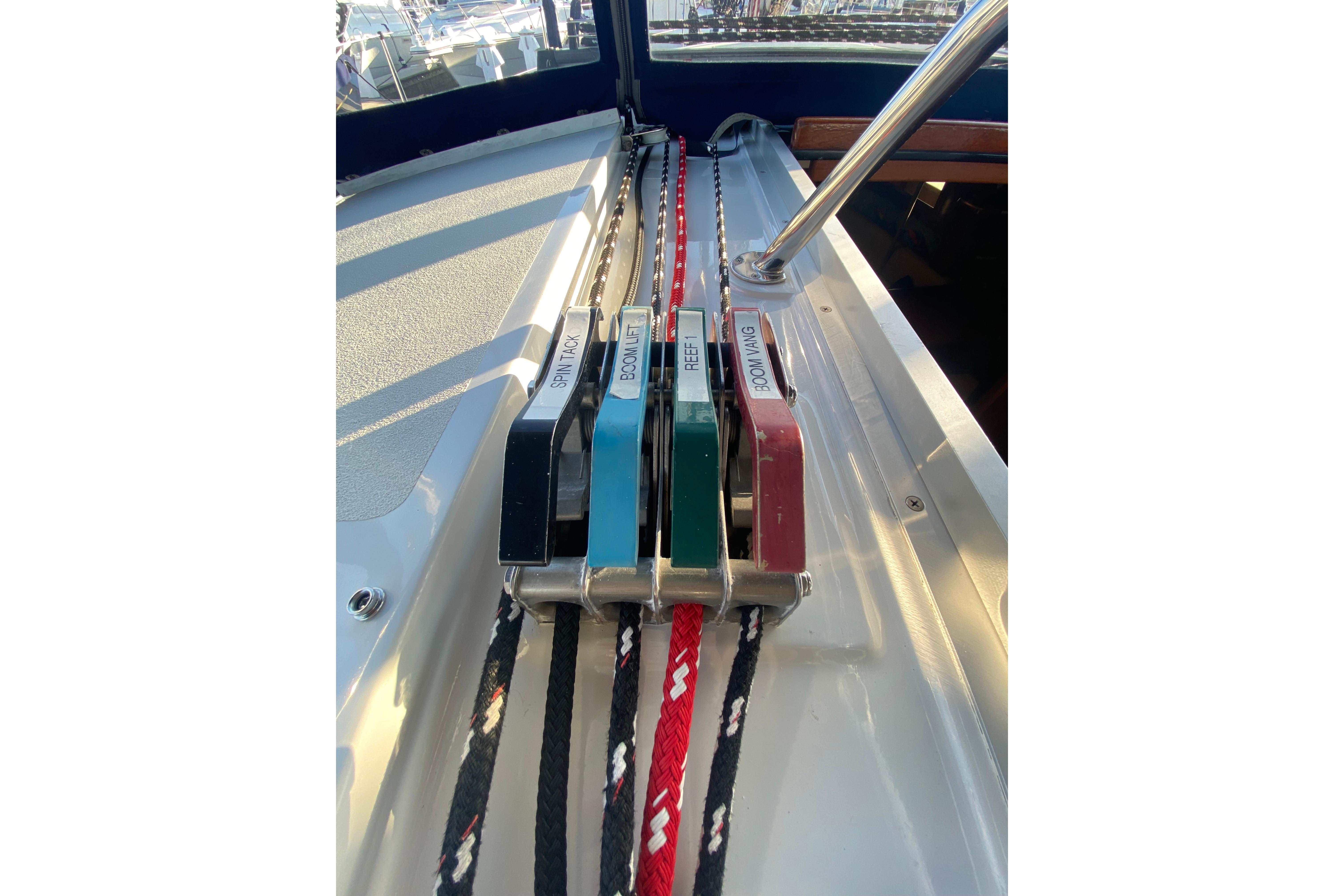 Sailboat control lines on a 1997 Hunter Legend 40.5, featuring labeled clutches and ropes.