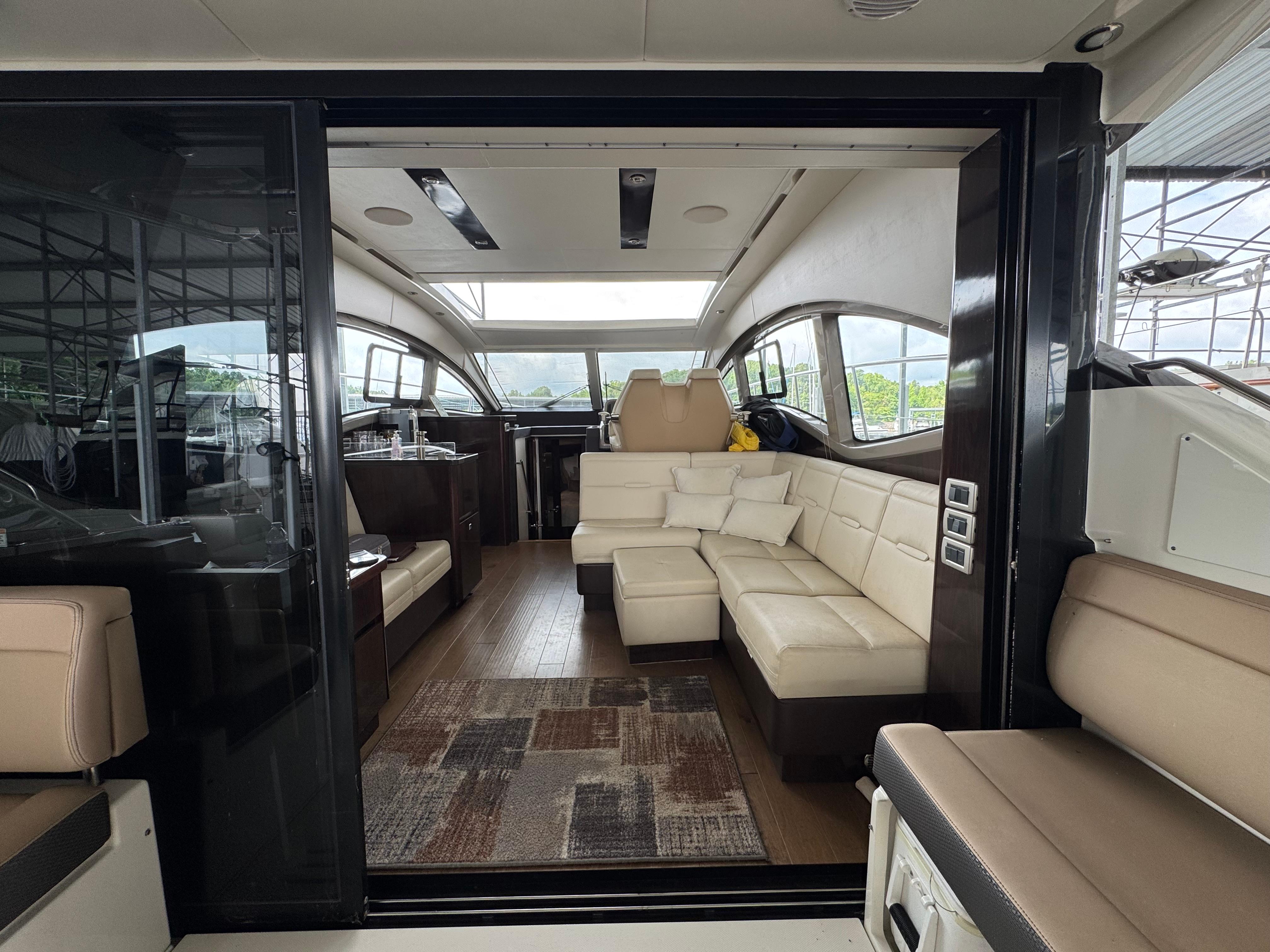 Luxurious interior of 2017 Sea Ray Sundancer 400 yacht with plush seating and modern design.
