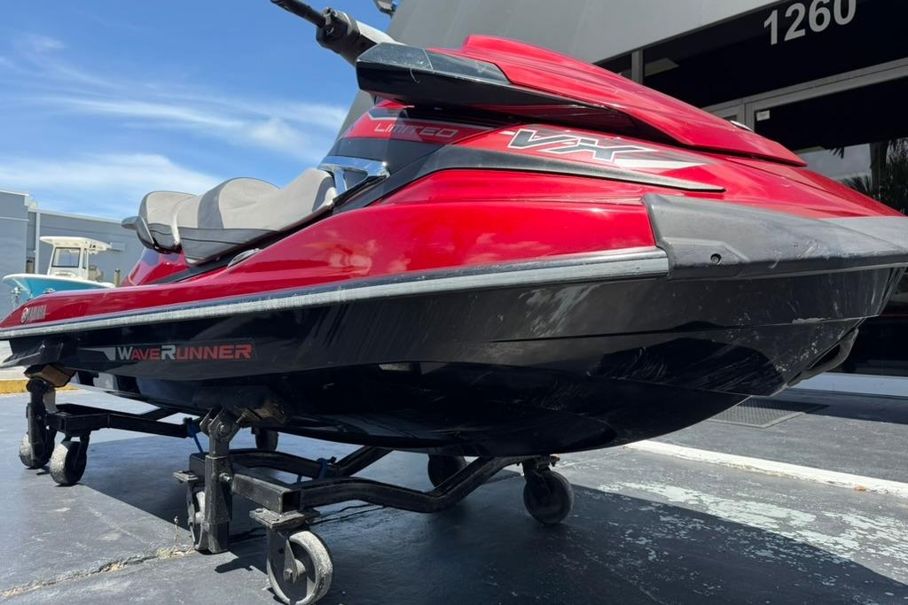 2019 Yamaha VX Limited WaveRunner in red and black on a trailer, parked outdoors.