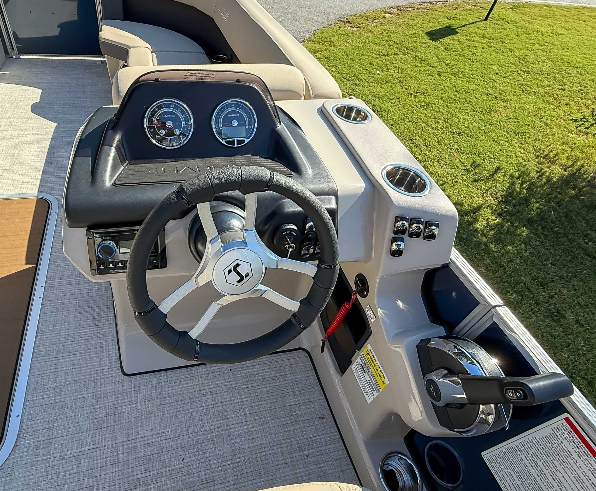 2025 Harris Cruiser 250 CWDH boat dashboard and steering wheel.