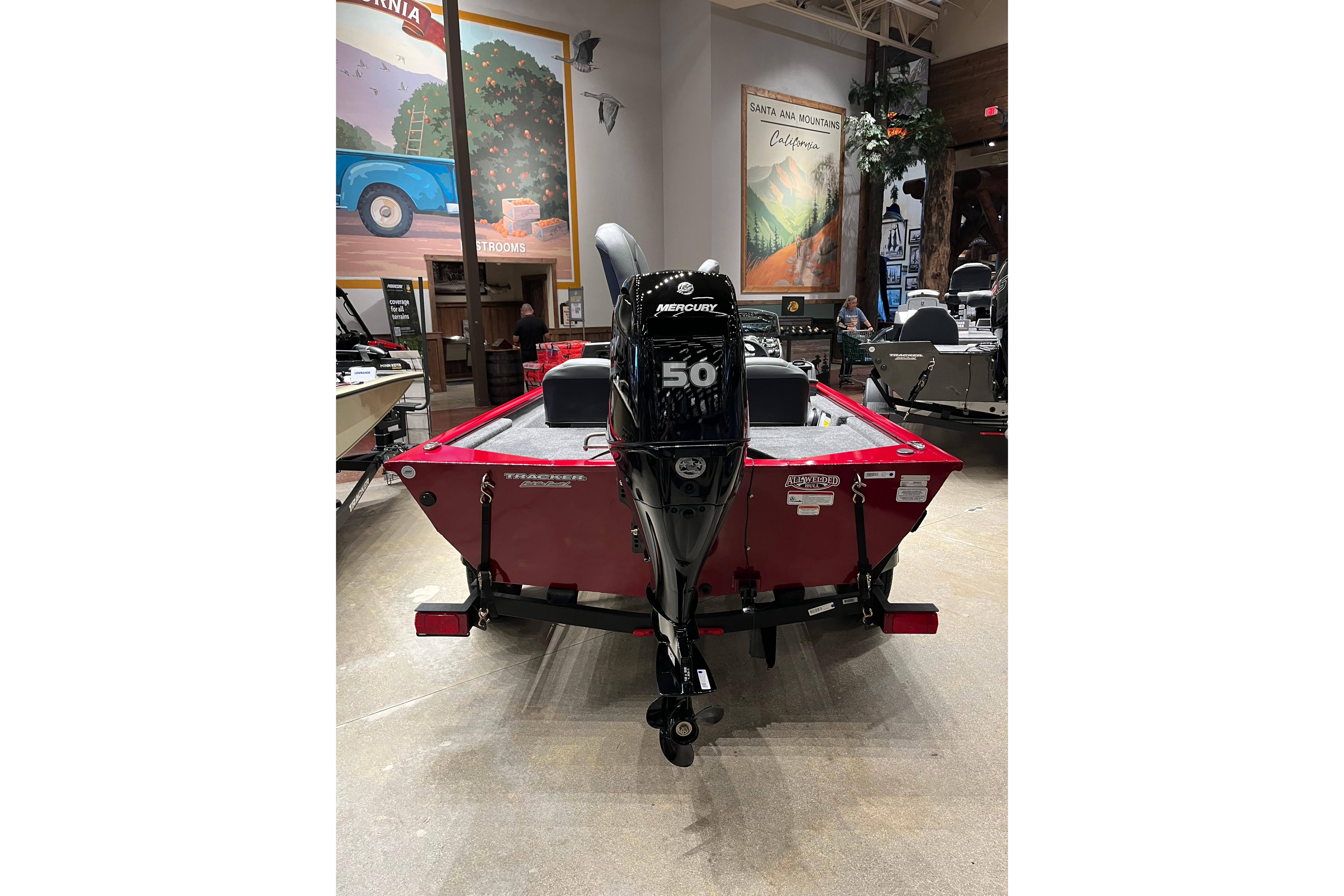 2026 Tracker Pro 170 boat with Mercury 50 engine displayed indoors.