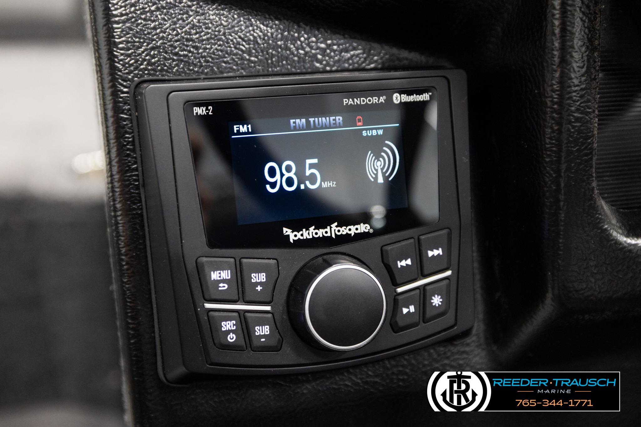 Rockford Fosgate PMX-2 stereo in 2026 Lund 1975 Tyee, displaying FM 98.5 MHz.