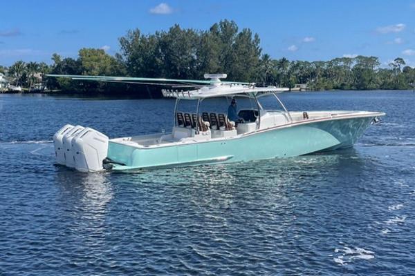 2025 Mag Bay 43 Center Console boat on a calm lake.