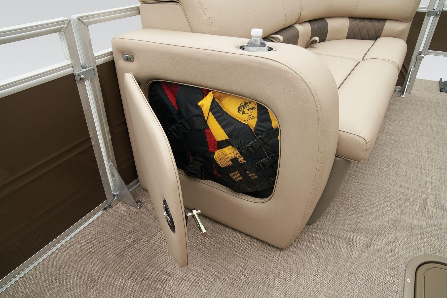 2023 Sun Tracker SportFish 22 XP3 boat seat storage with life jackets.