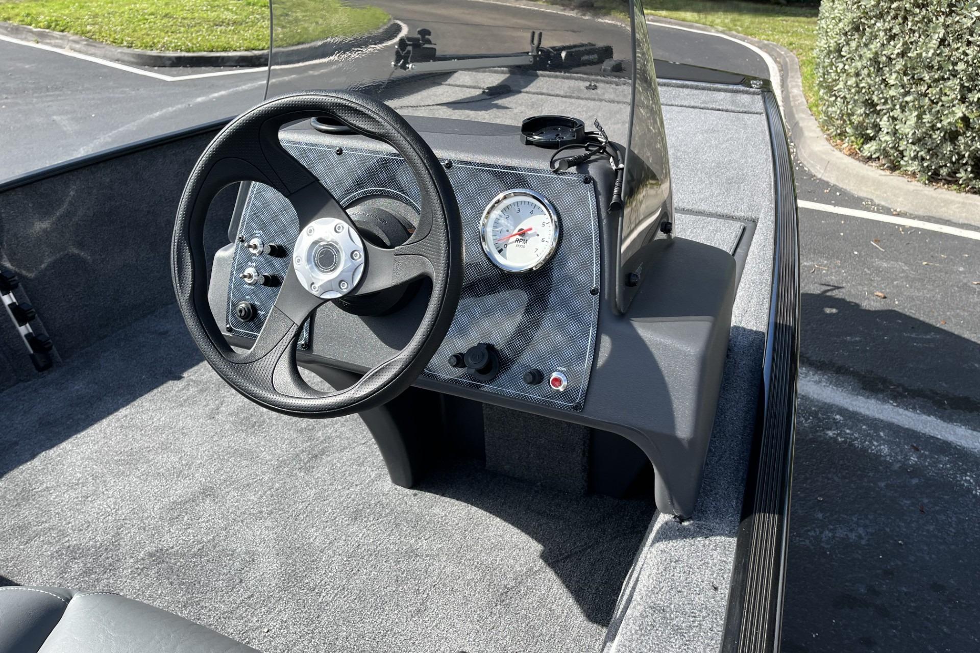 2026 Tracker Bass Tracker Classic XL boat dashboard with steering wheel and gauge.