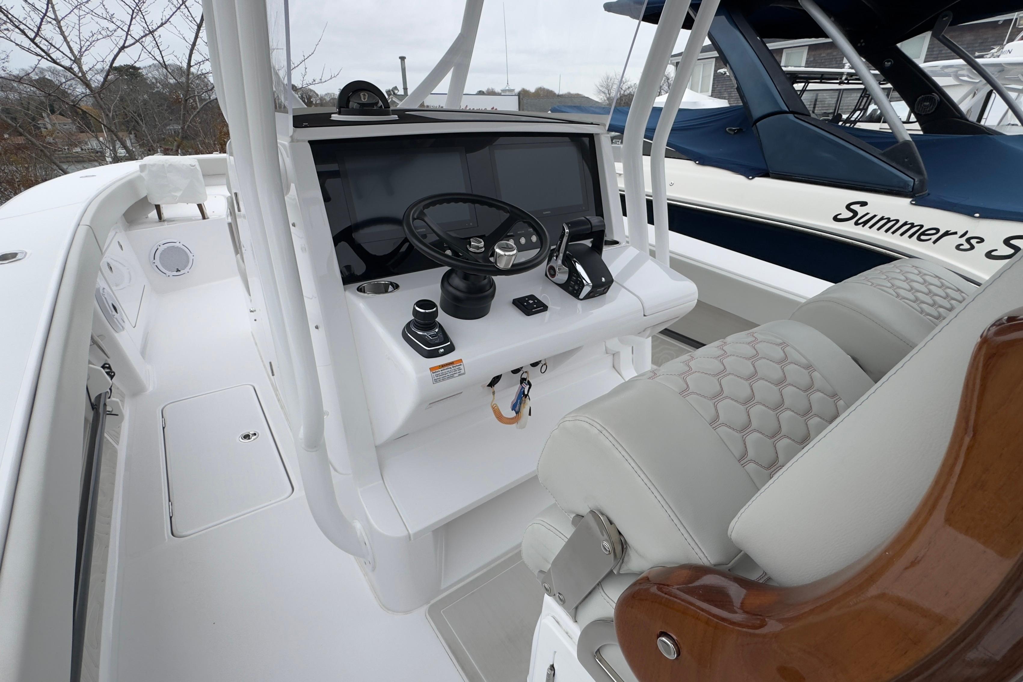 2024 Jupiter 32 FS boat cockpit with modern steering and controls.