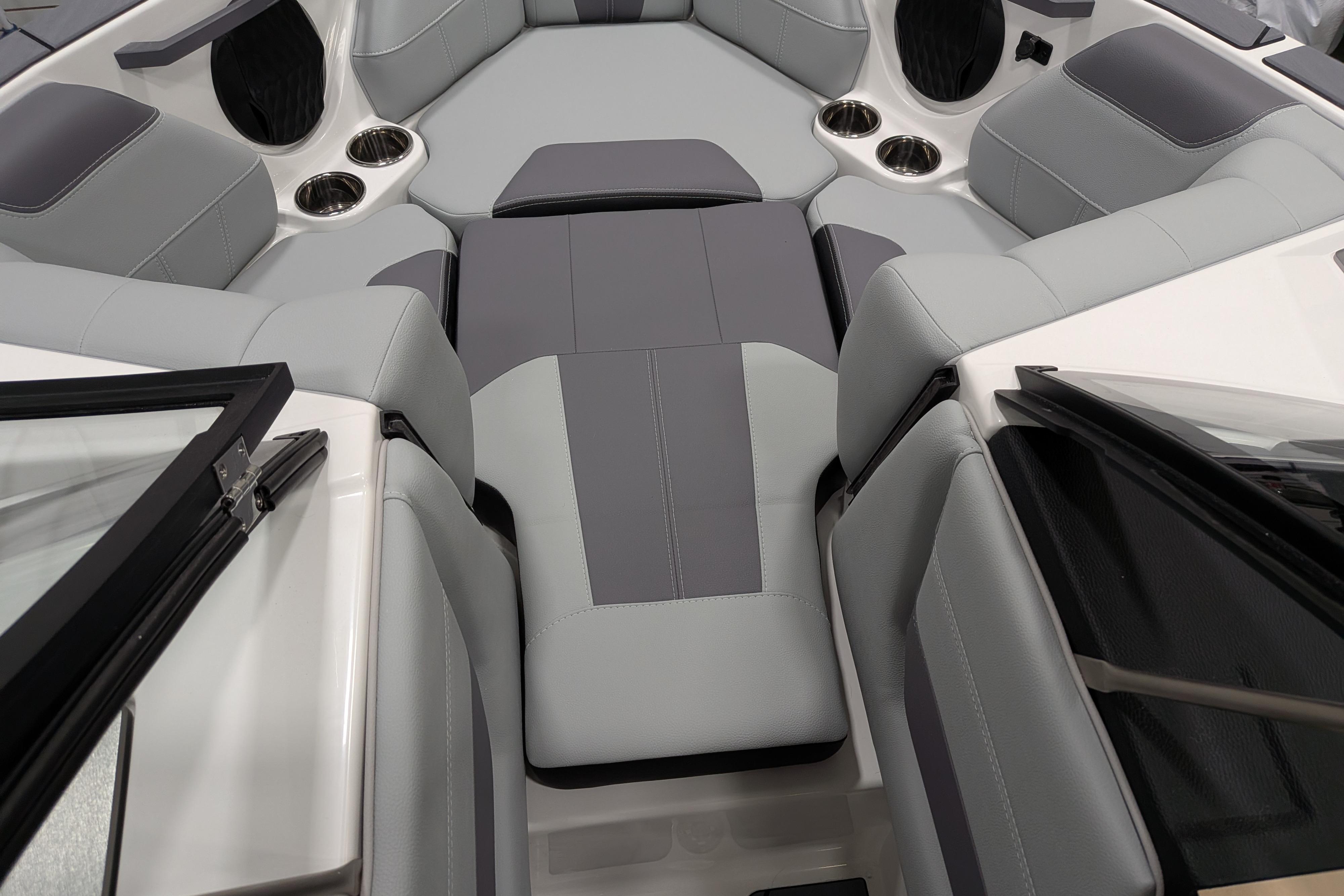 Interior of 2026 Malibu Wakesetter 20 VTX boat with gray seating and cup holders.