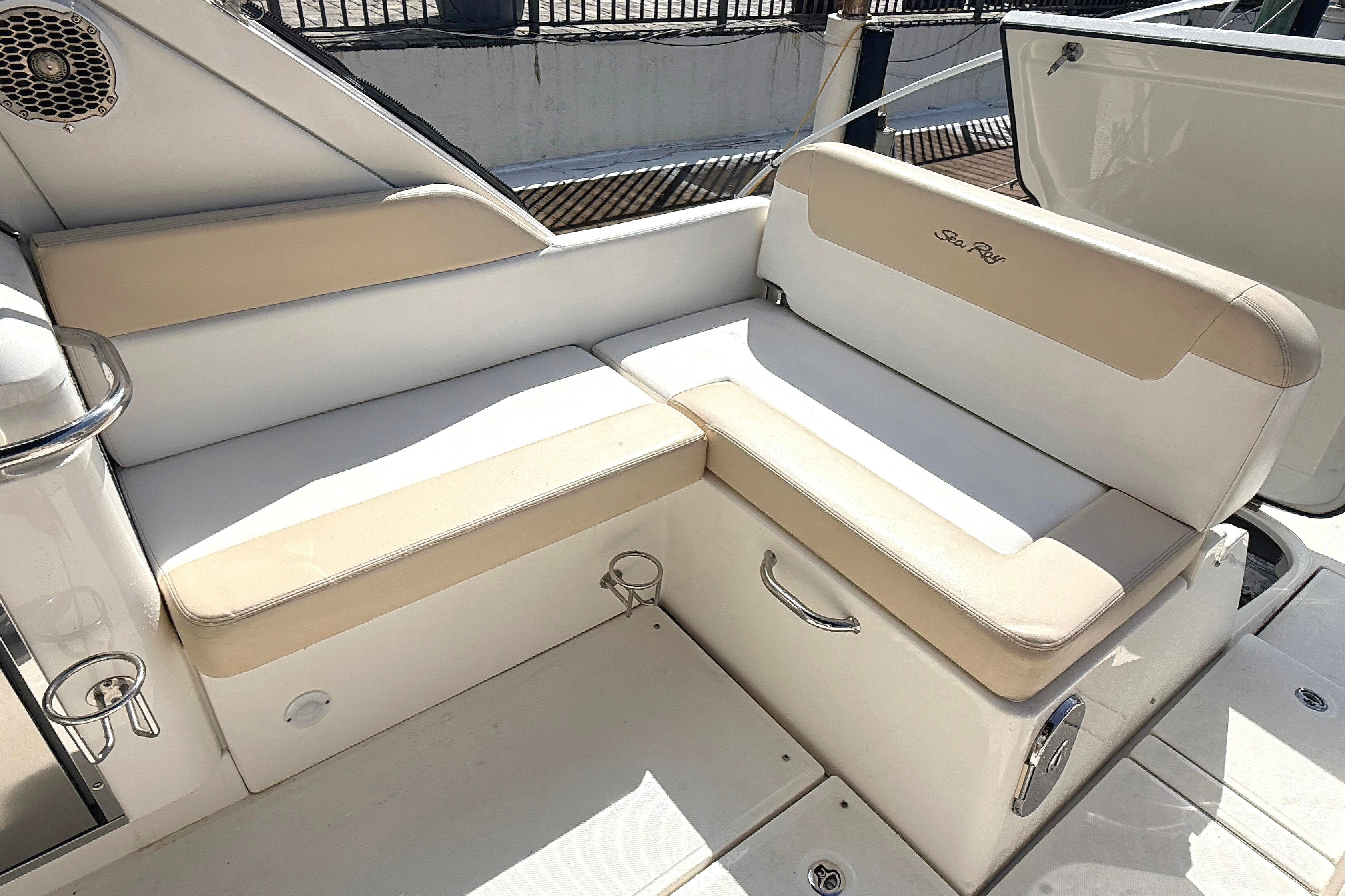 2013 Sea Ray 370 Venture boat seating area with beige and white upholstery.