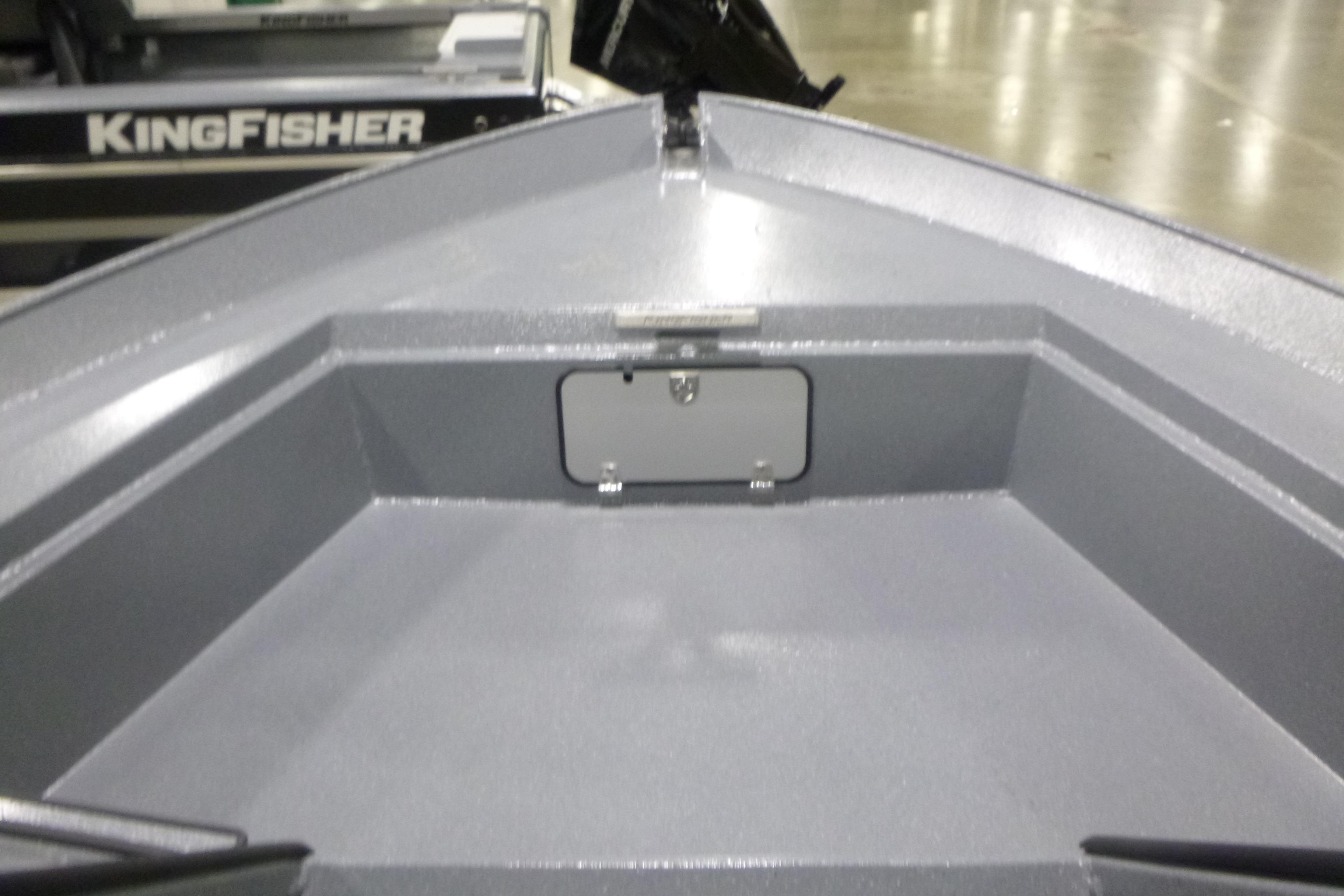 2026 KingFisher 2425 Escape HT boat interior, showcasing spacious storage compartment.