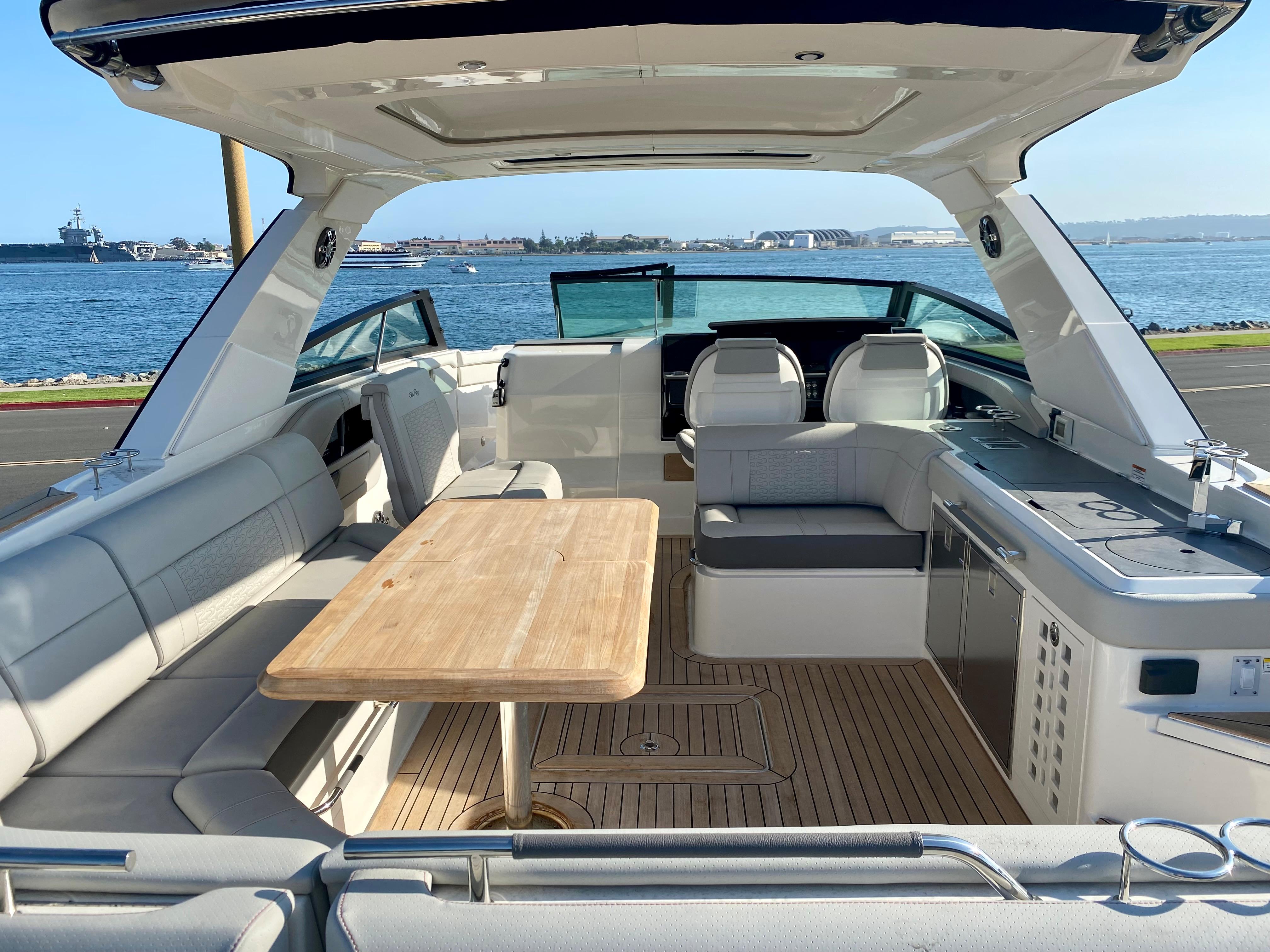 Interior of a 2021 Sea Ray SLX 400 Outboard yacht by the water.