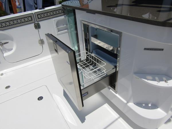 2024 Wellcraft 352 Fisherman boat with open storage compartment.
