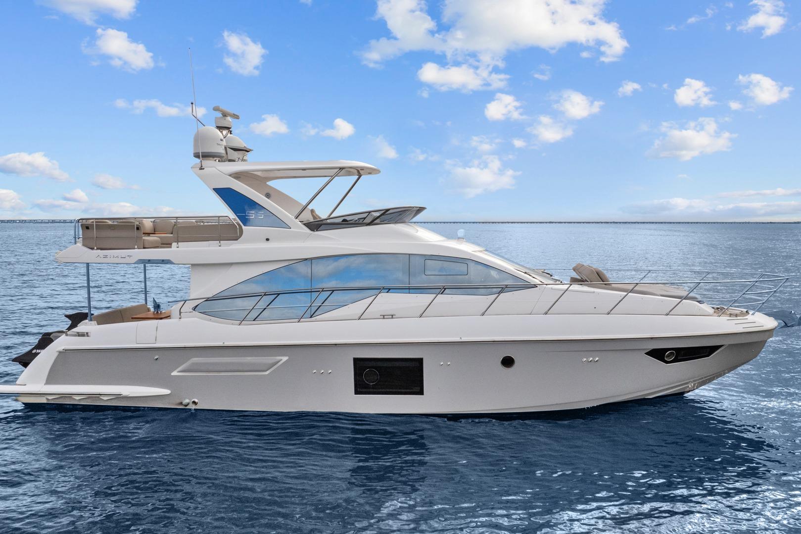 Luxury 2019 Azimut 55 yacht on calm ocean waters under a clear blue sky.
