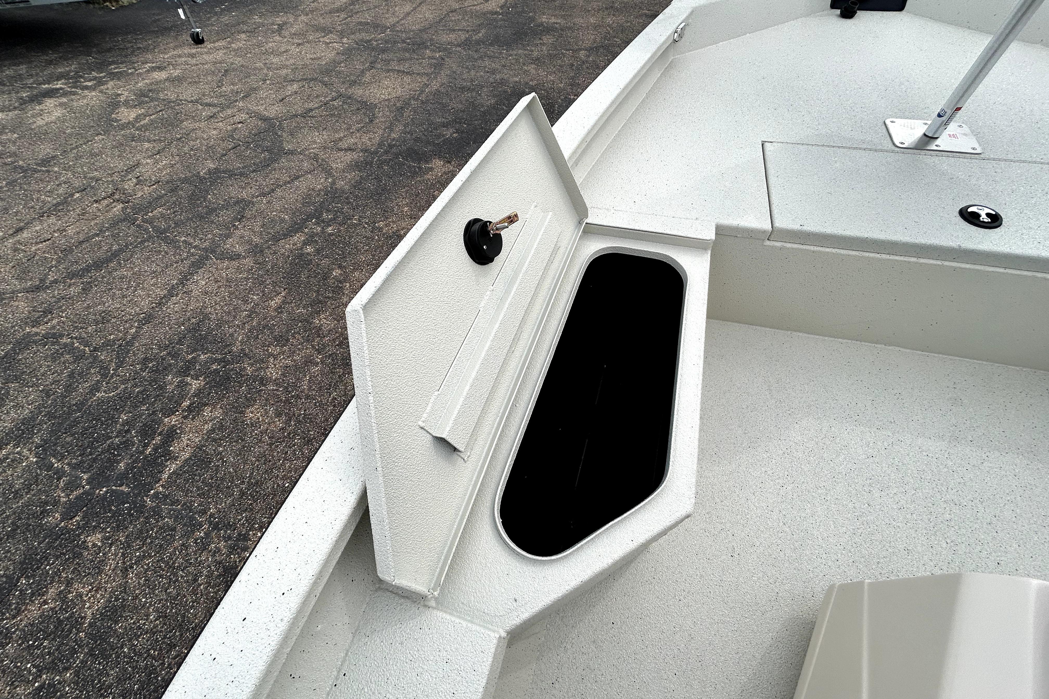 2026 Xpress H20B Bay boat storage compartment open on deck.