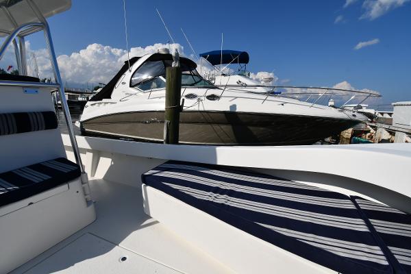 2021 Eastern 248 Center Console boat docked at marina with clear blue sky.