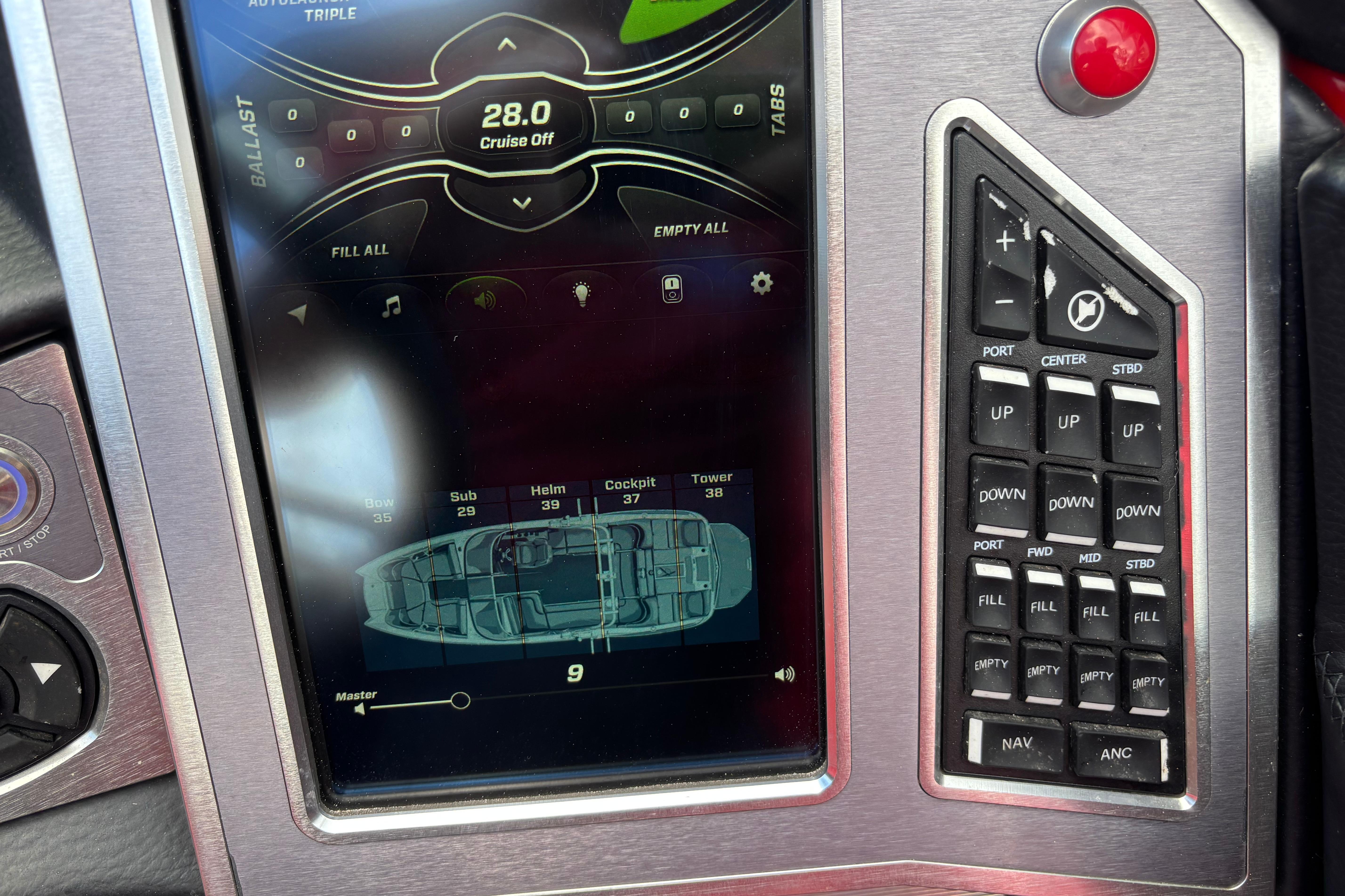 Control panel of a 2020 MasterCraft X24 boat, displaying ballast and navigation settings.