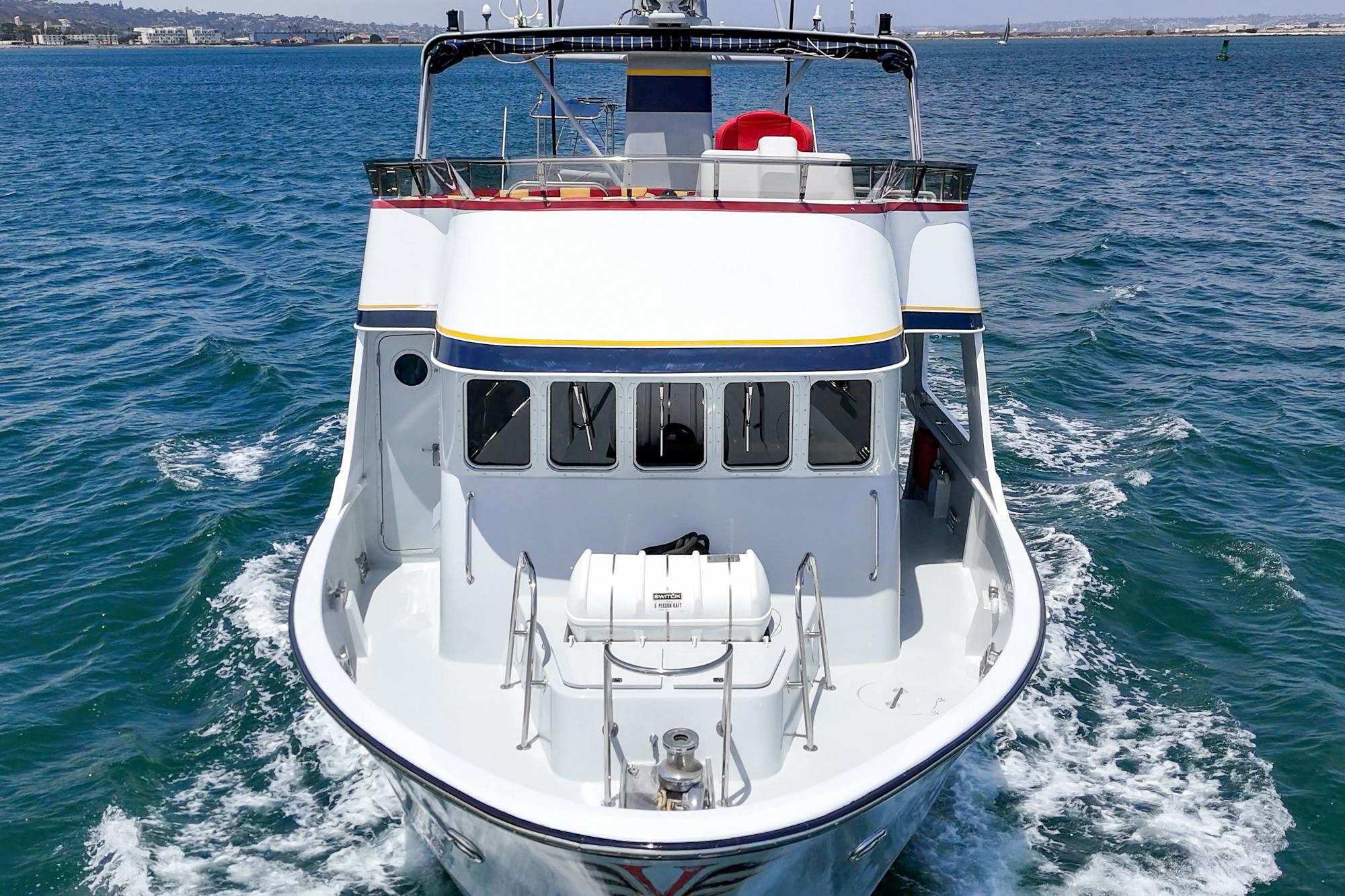 Seaton Long Range Cruiser 1990 navigating on open water, showcasing its sleek design.