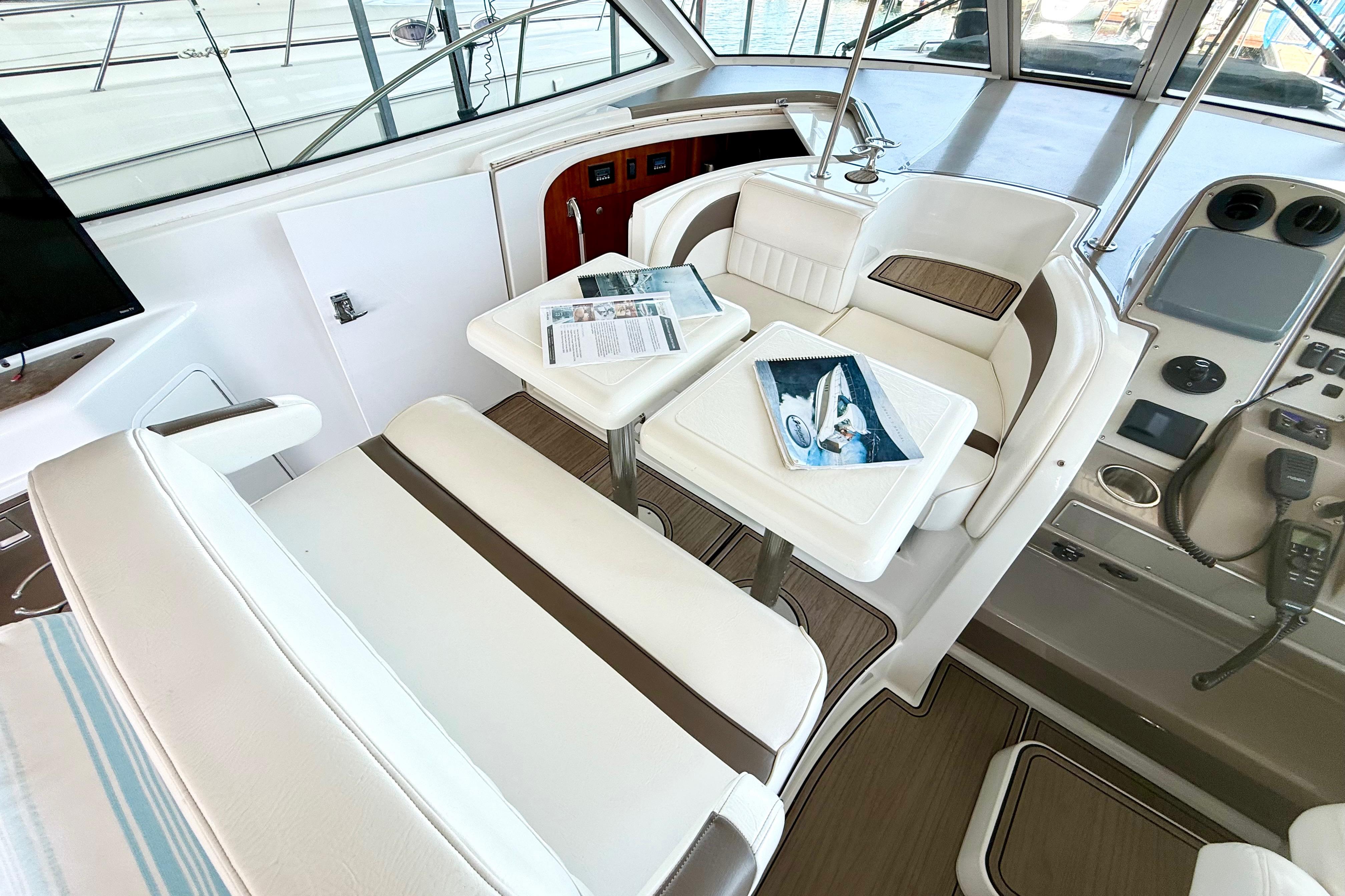 Luxurious interior of 2011 Cruisers Yachts 390 Sports Coupe with elegant seating and table.