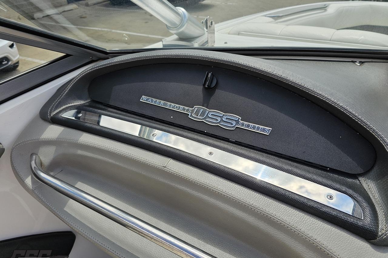 Dashboard of a 2010 Cobalt 232 WSS boat, featuring sleek design elements.