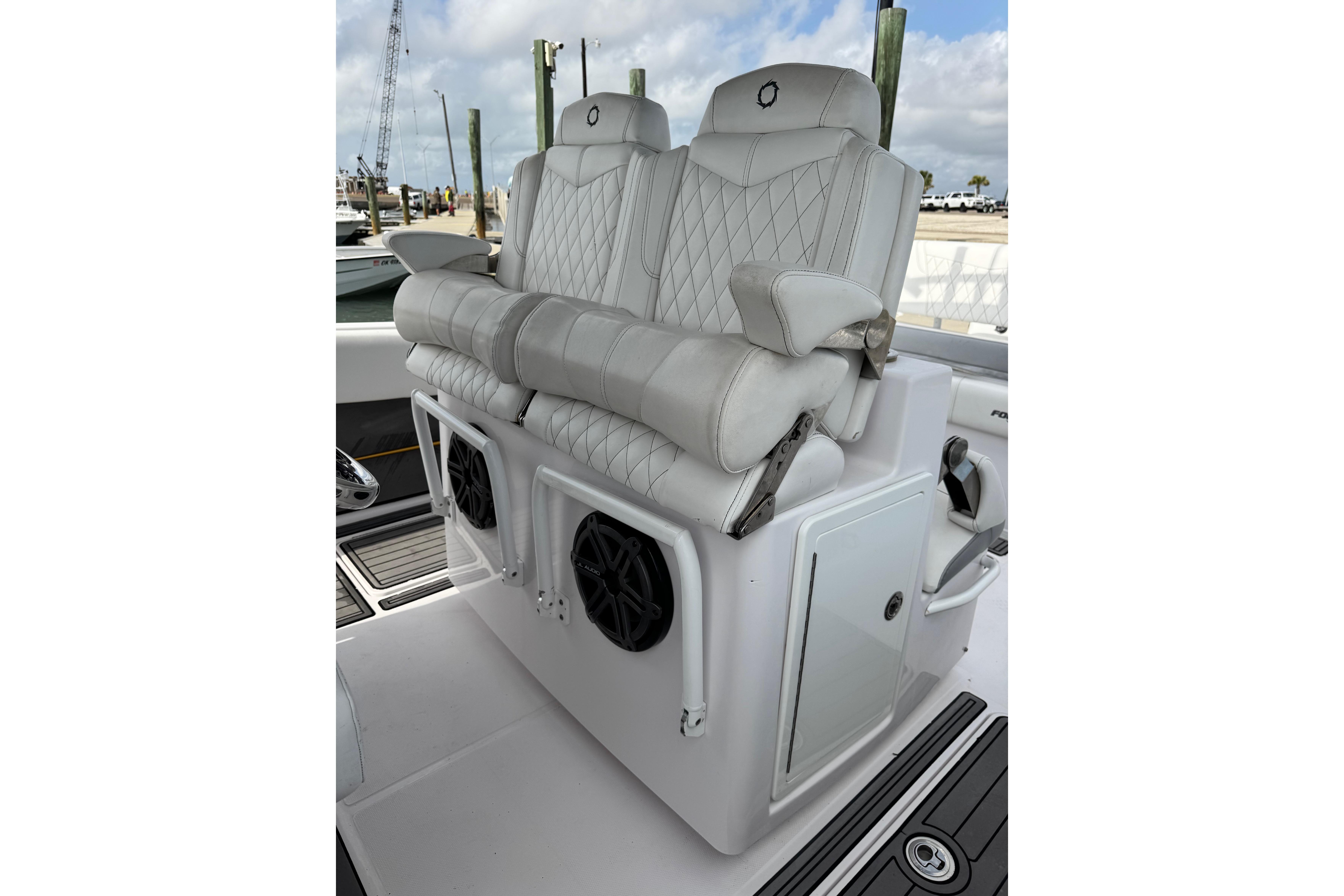 Luxurious seating on 2018 Fountain 34 Center Console boat with diamond-stitched upholstery.