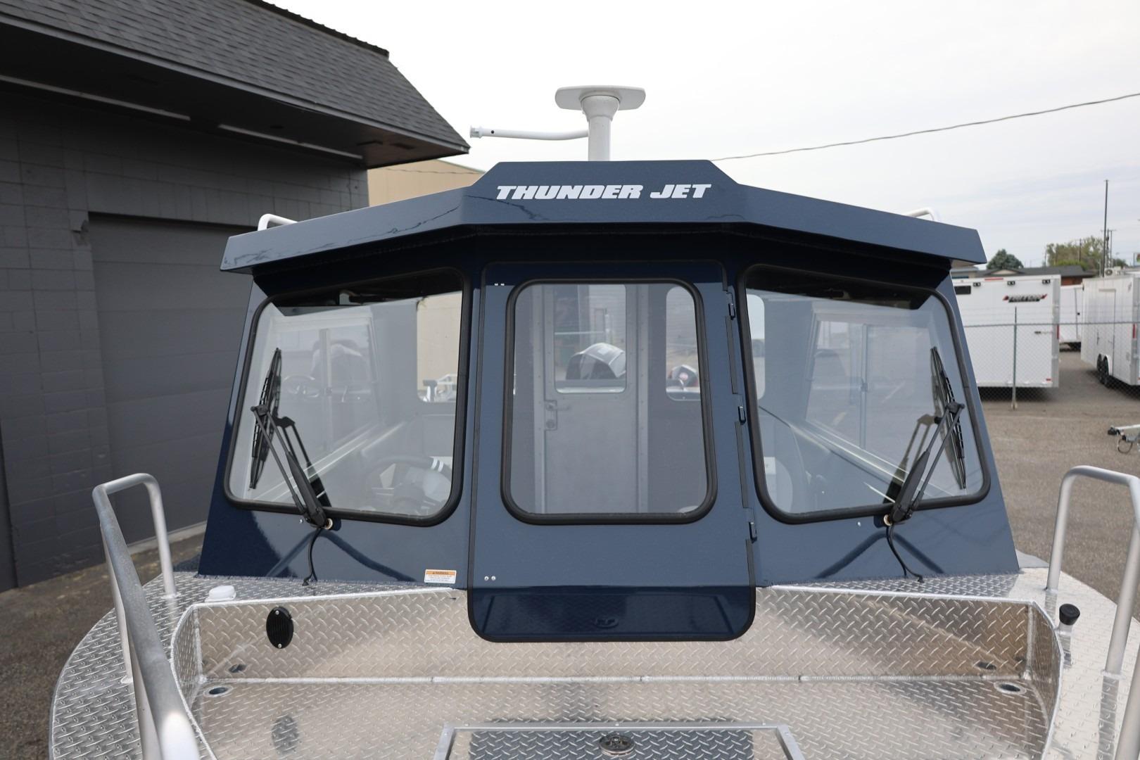 2026 Thunder Jet 24 Alexis Pro boat with blue cabin and windshield wipers.