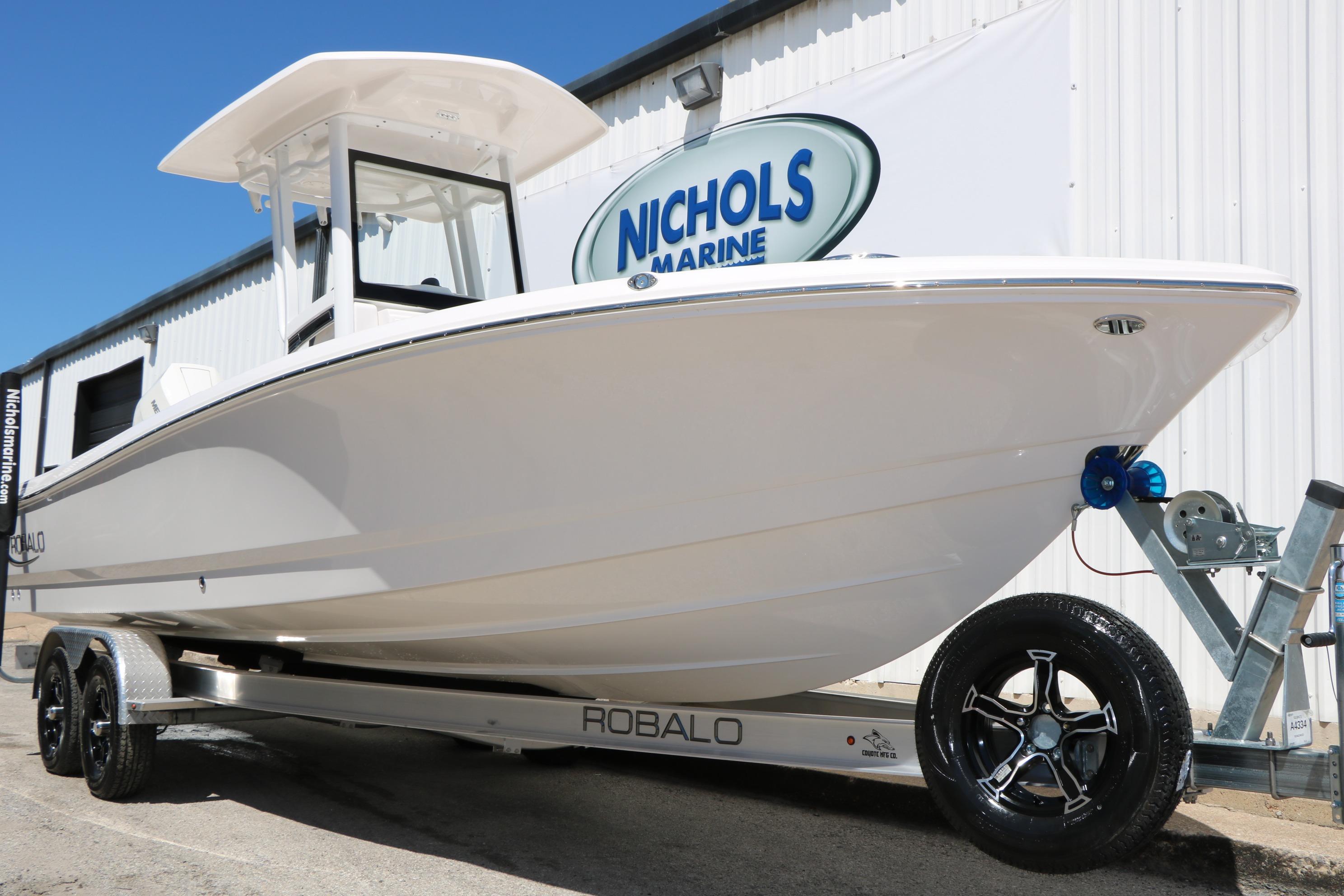 2026 Robalo 246 Cayman boat on trailer at Nichols Marine dealership.