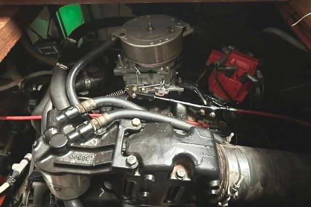 Engine compartment of a 1989 Carver 32 Aft Cabin Motor Yacht, showcasing mechanical components.