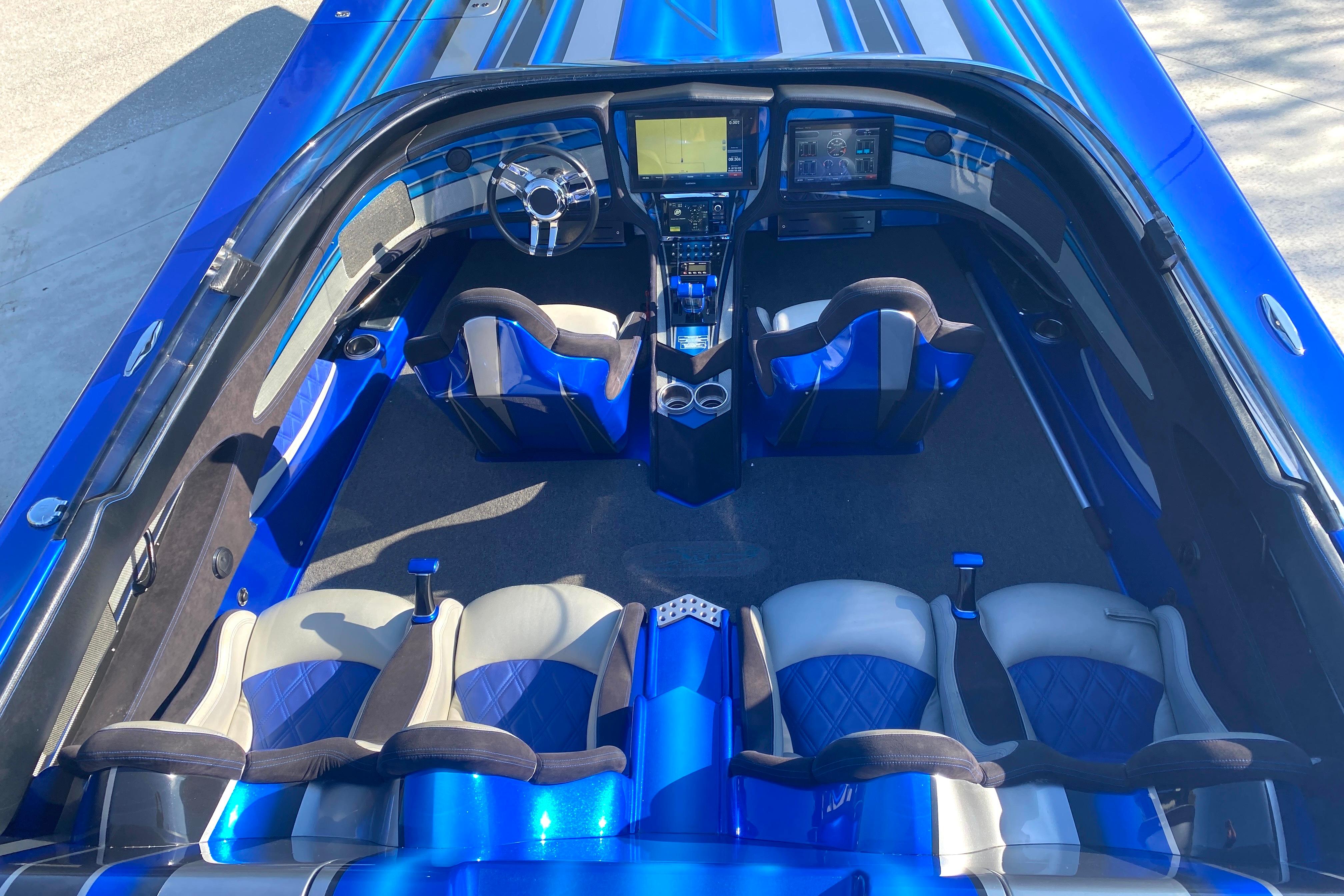 Interior of a 2016 MTI 44 RP boat with blue and gray seating.